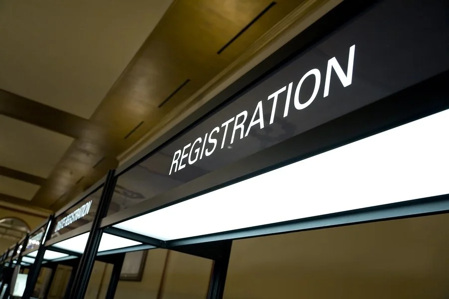 bigstock-Registration-Booth-Sign-4220527.jpg