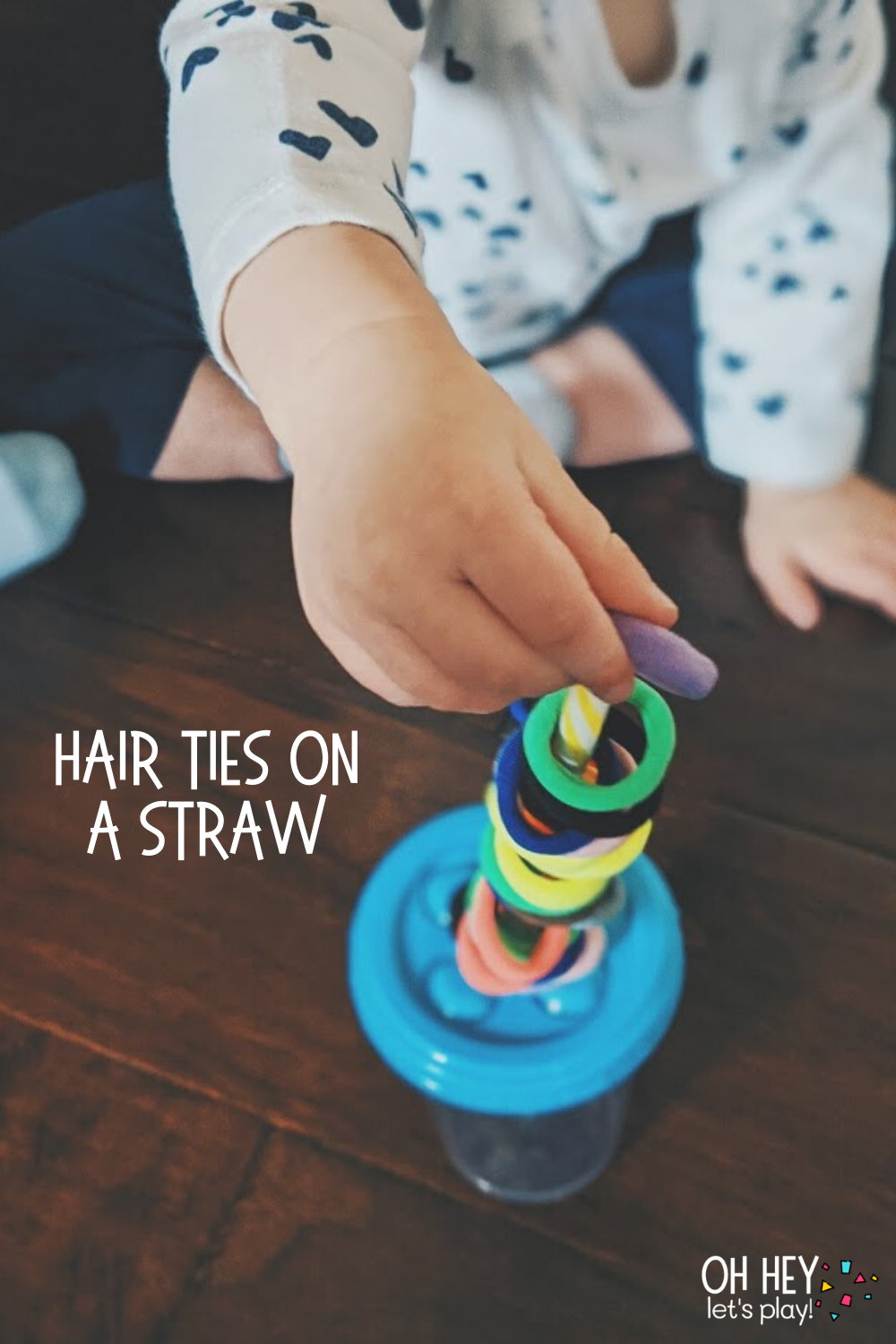 Hair Ties on a Straw 30+ Activities for 1-2 Year Old Toddlers - Oh Hey Let's Play www.ohheyletsplay.com.png