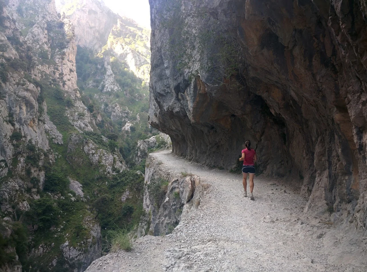 The path is literally carved out of a vertical rock face.