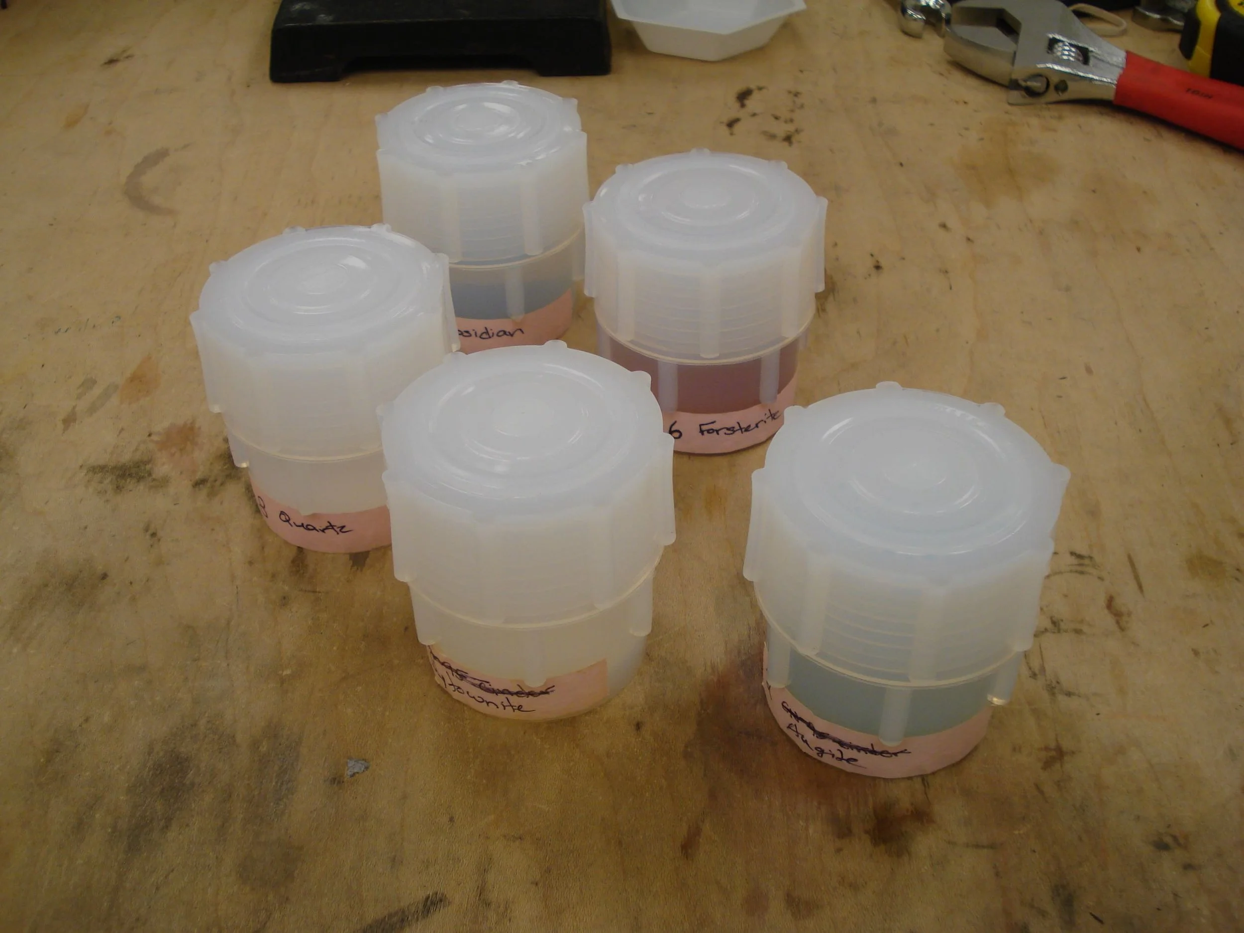 Ground up minerals were sealed in Teflon containers with varying amounts of sulfuric acid and heated at a range of temperatures and for up to 6 months.