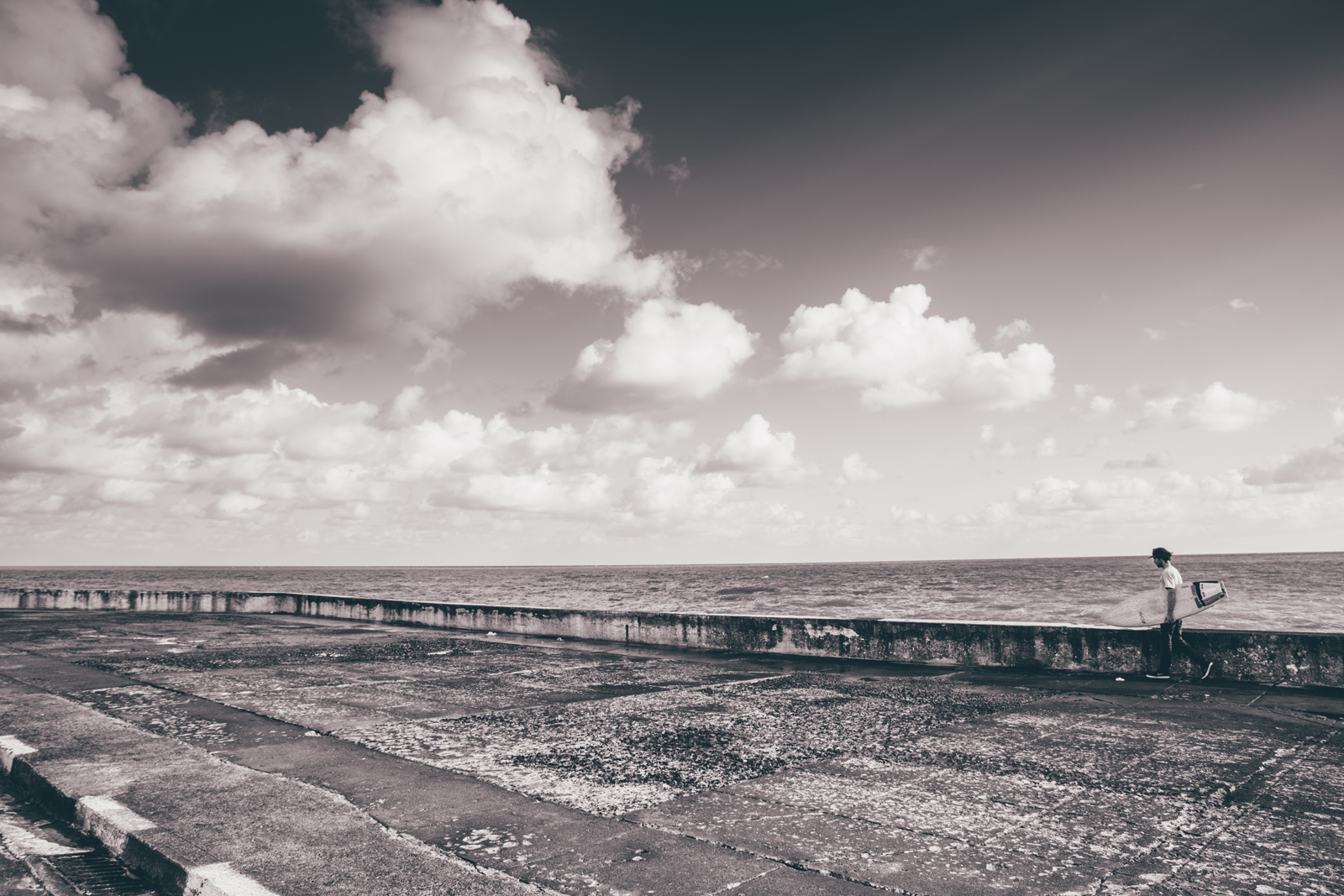 Frank Gonzalez walks along the Malecón in Havana. This particular stretch of the sea wall has become a hot spot for new businesses thanks to economic reform.
