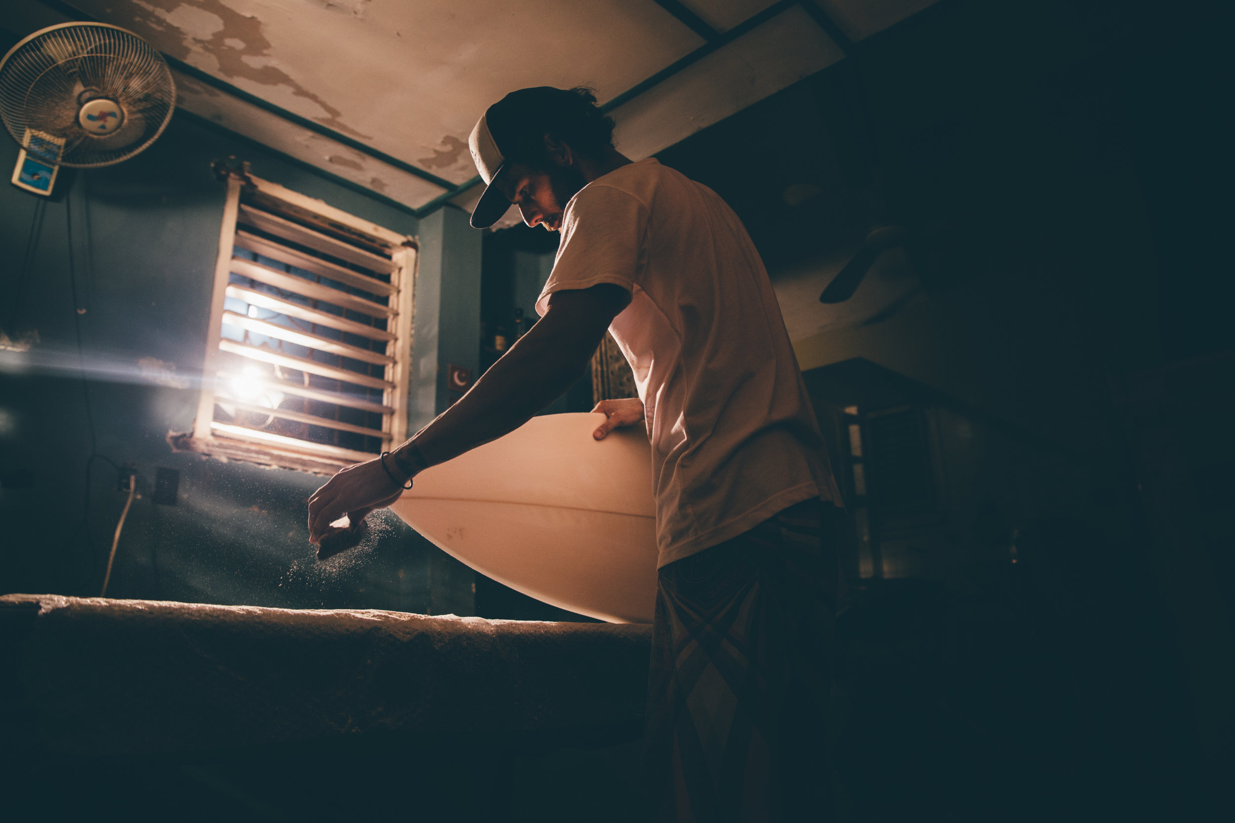 Foam blanks scavenged from refrigerator doors, an old cheese grater used in place of a planer, the ingenuity of the underground Cuban board builder in action. Photo: Marco