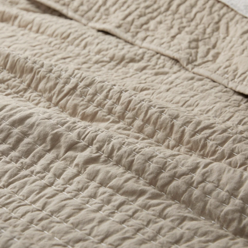 coyuchi-pebbled-handstitched-quilt-hazel-chambray-detail.png