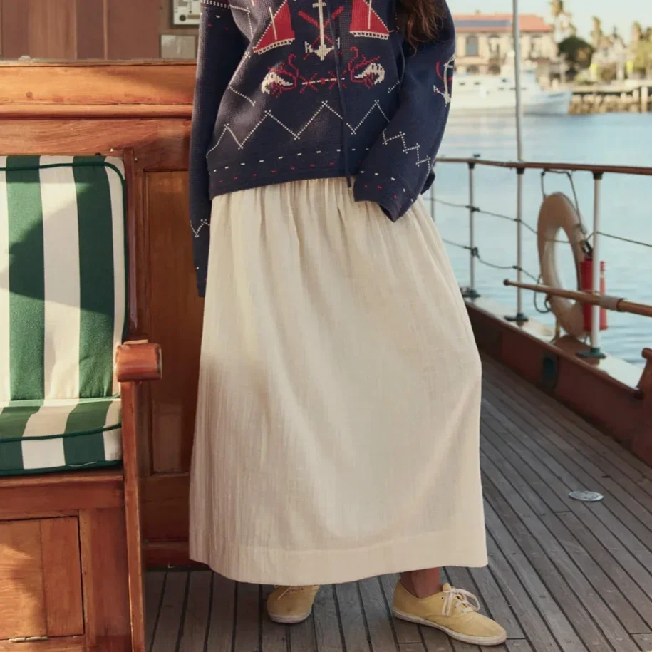 THE-GREAT-LOOK-53-THE-FISHERMAN-LACEUP-PULLOVER-NAVY-THE-VIOLA-SKIRT-NATURAL-04031_4b8640b3-009b-49c7-a61b-d2677a67886a_1080x.webp