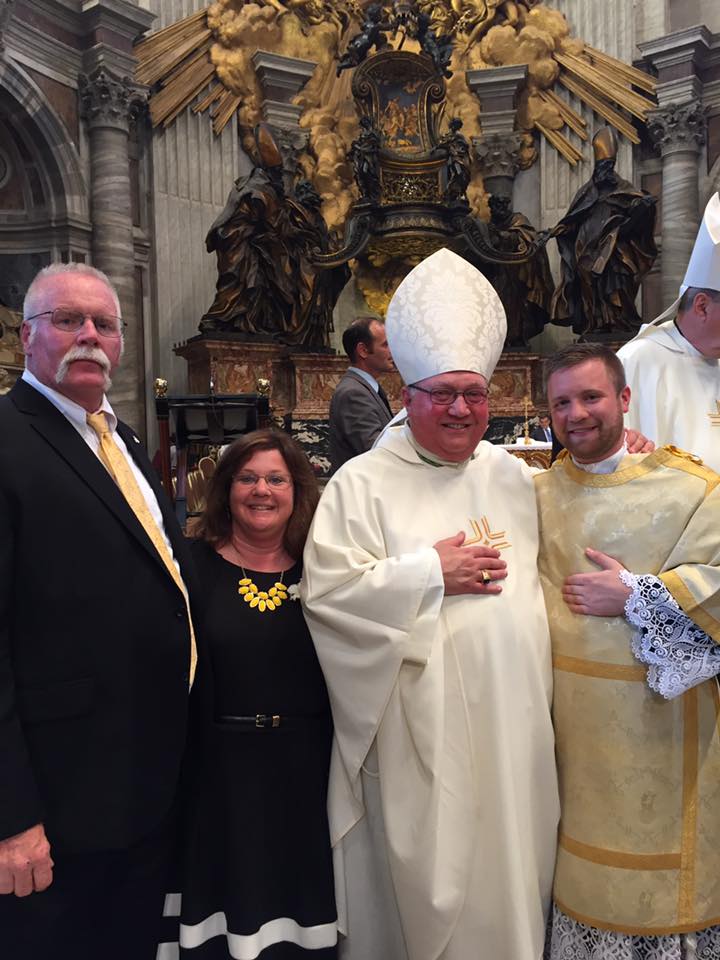 Deacon Andrew Showers with his parents and Bishop Morlino of the Diocese of Madison.