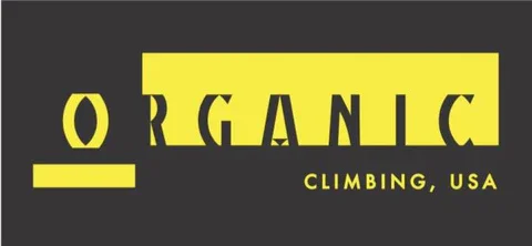 Logo with the word 'ORGANIC' in yellow text on a black background, and 'CLIMBING, USA' in smaller yellow text underneath. The 'O' in 'ORGANIC' is stylized as a circle with a yellow underline.