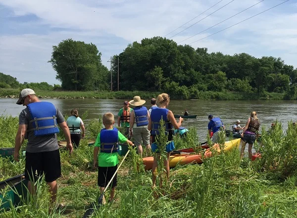 Participants prepare to put their canoes and kayaks in at the future site of the Todd Town Access during the Swinging Bridge Festival 2016.