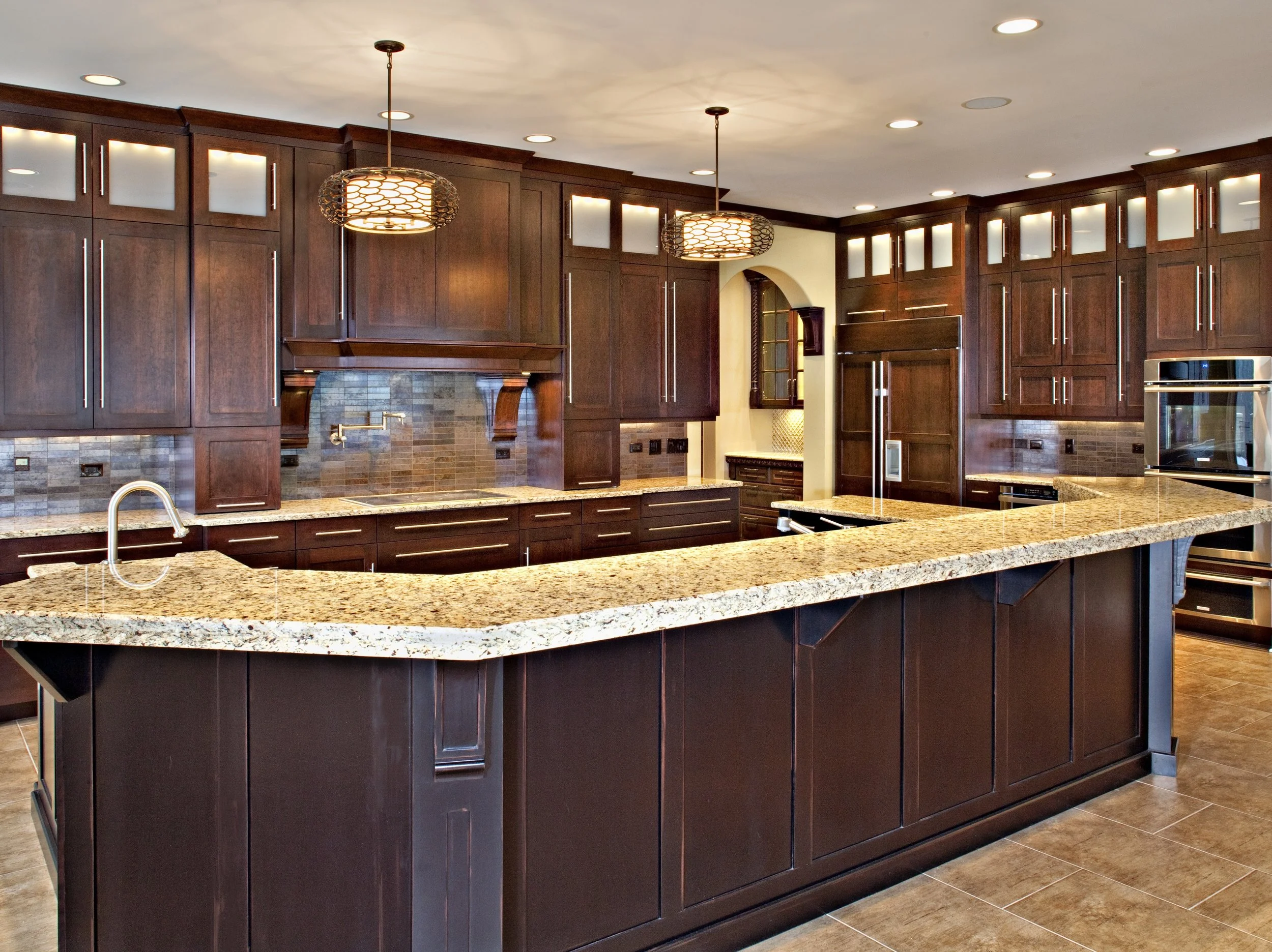 Transitional Kitchen in Geneva Illinois 60134.  Double Stack Cabinets w/ Frosted Glass