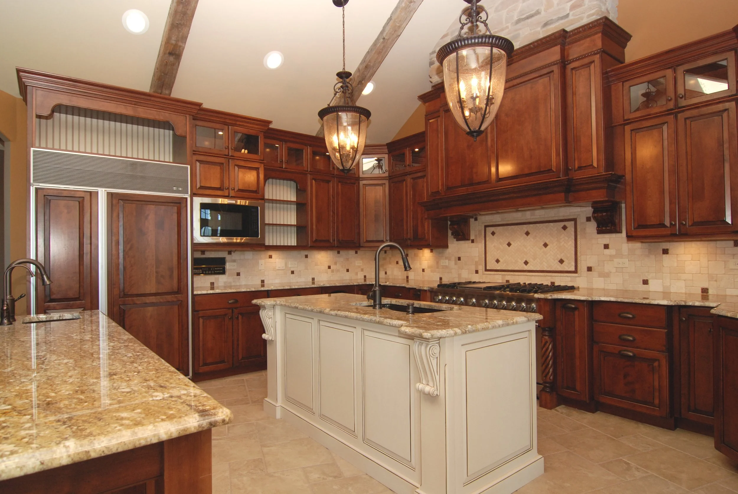 Custom Kitchen Remodel in the Woods of Fox Glen St. Charles IL 60174.  Oversized Custom Hood.  Double Island