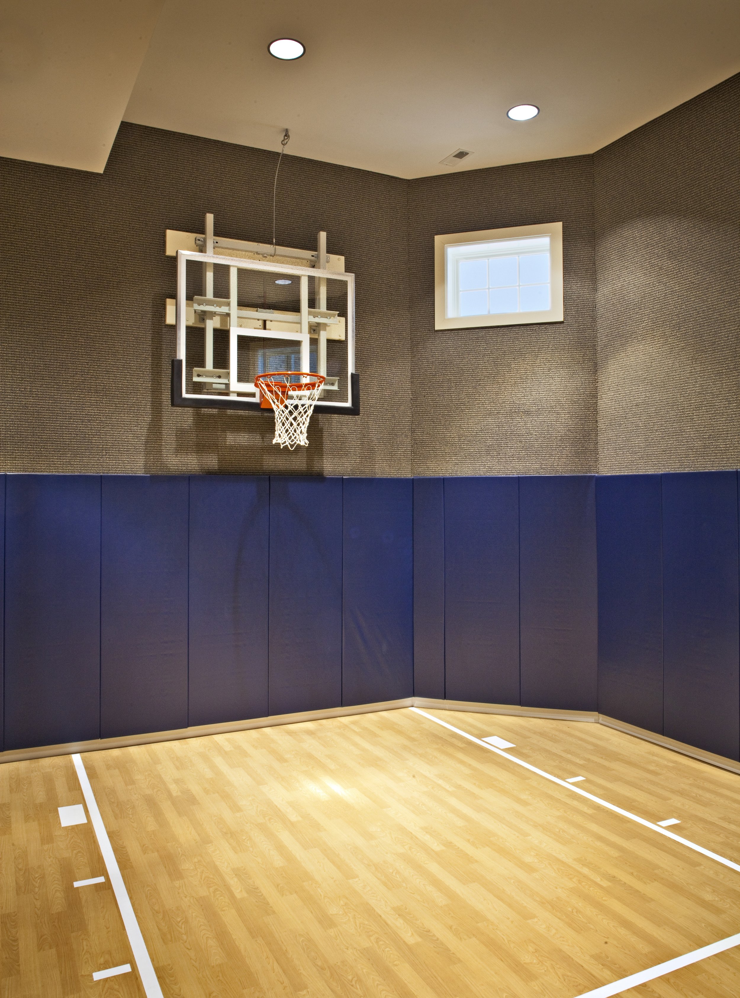 Custom Basement Sports Court in Oak Brook IL.  Basement Indoor Basketball Court.  By Southampton Builders LLC.