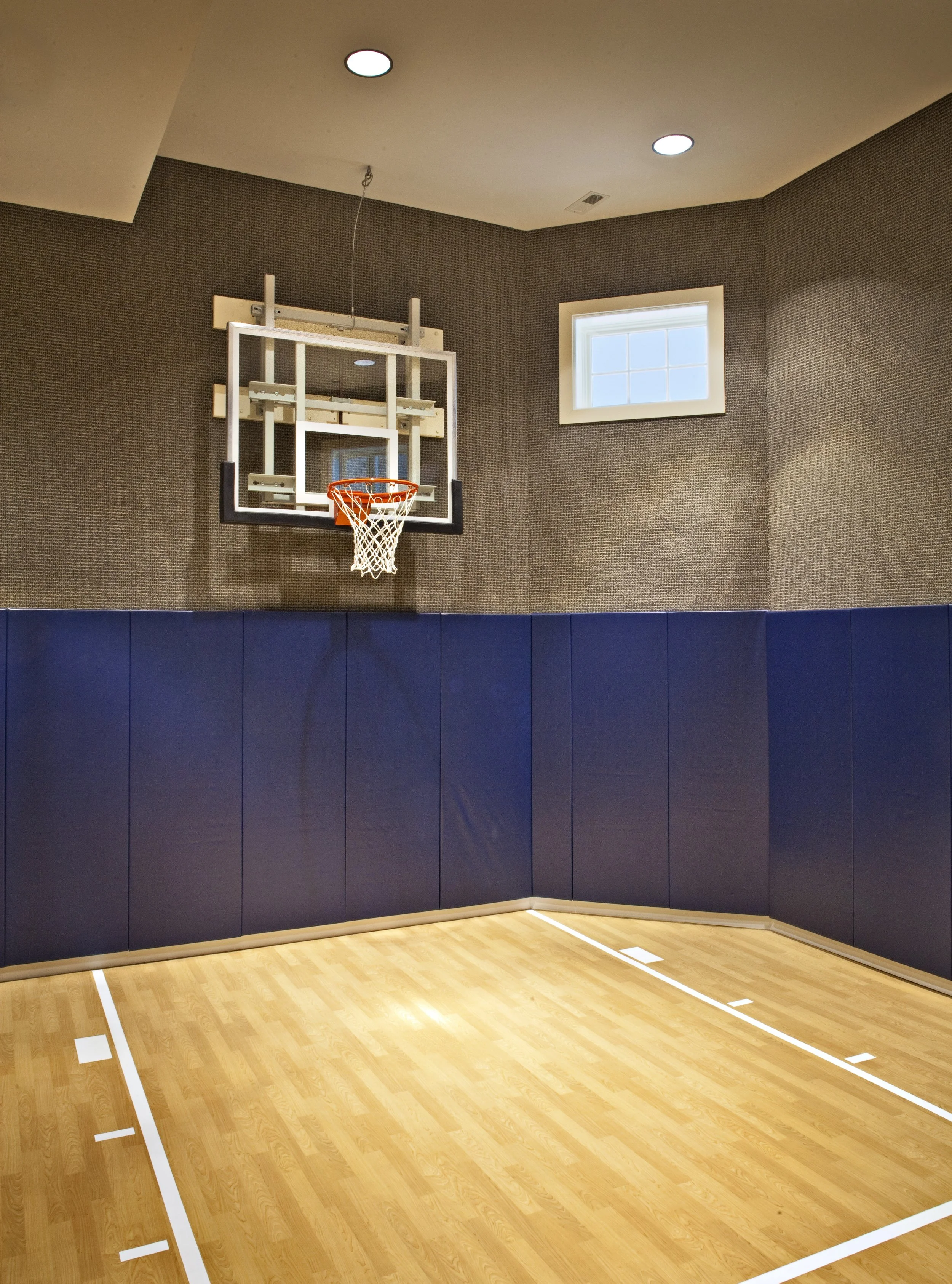 Custom Basement Sports Court in Oak Brook IL. Basement Indoor Basketball Court. By Southampton Builders LLC.