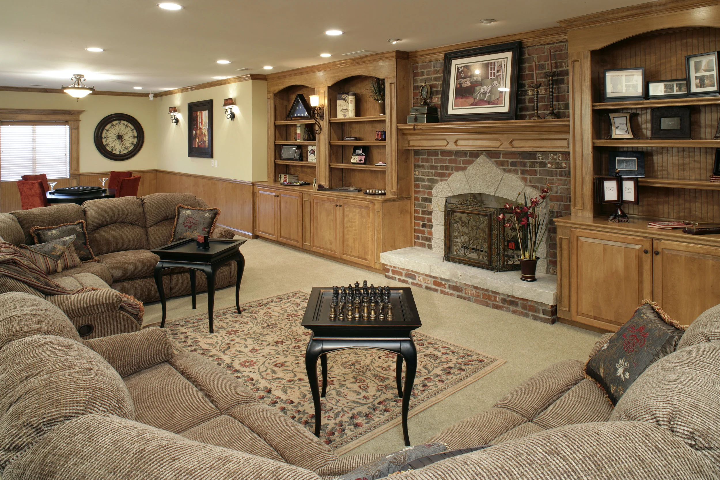 Basement Fireplace with Arched Stone Face & Hearth.  Stained Book Cases & Game Table.  Prairie Lakes Subdivision in St. Charles IL.