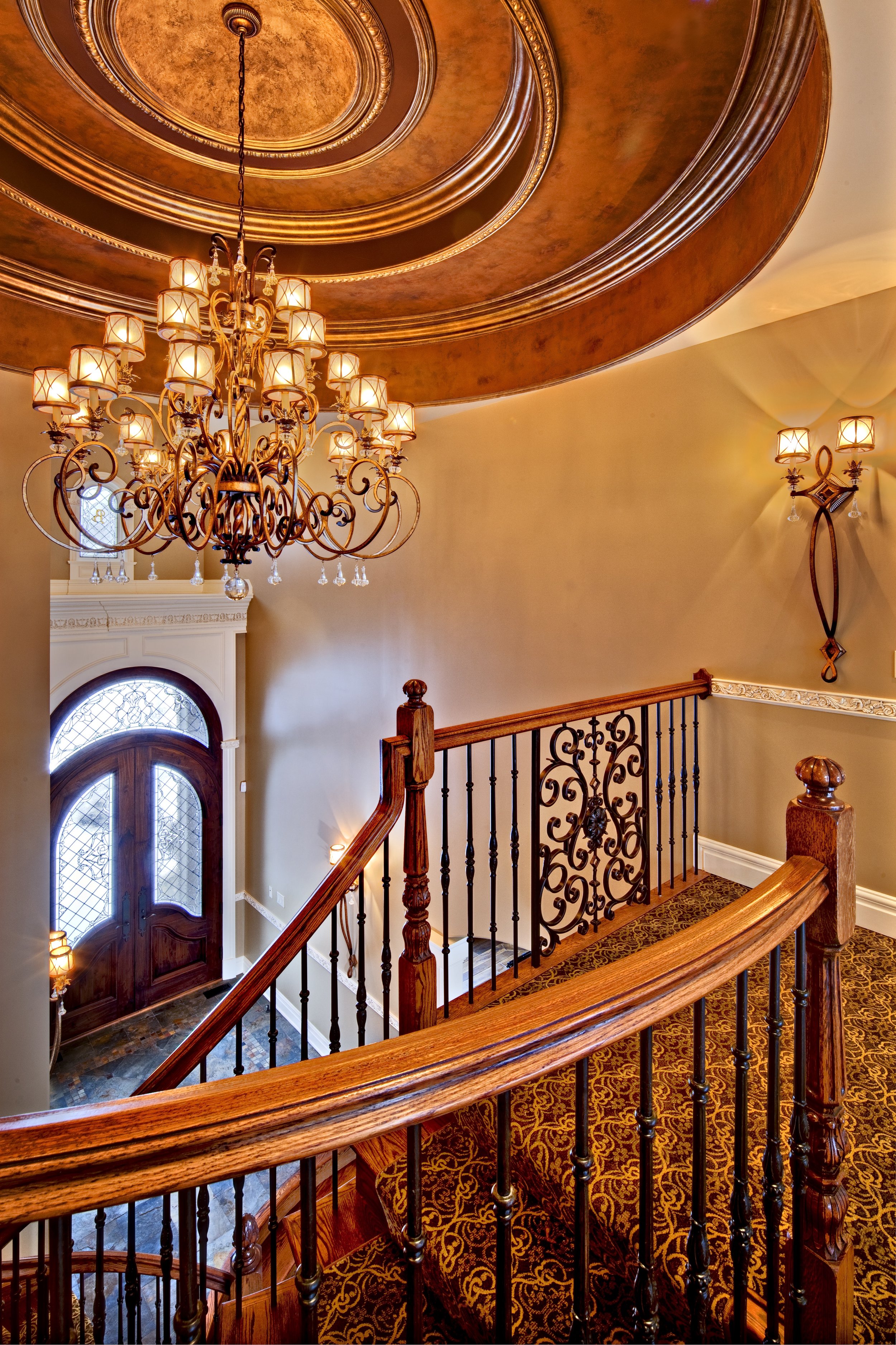 Grand Two Story Foyer with Large Chandelier and Curved Custom Staircase in this Naperville IL. Custom Home