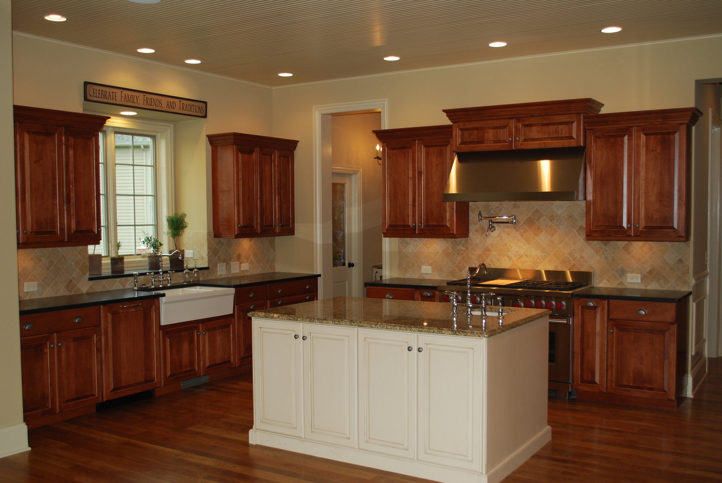 Custom Designed Kitchen by Southampton in St. Charles Illinois. Hidden Dry Bar & Pantry Door.  48" Dual Fuel Wolf Range