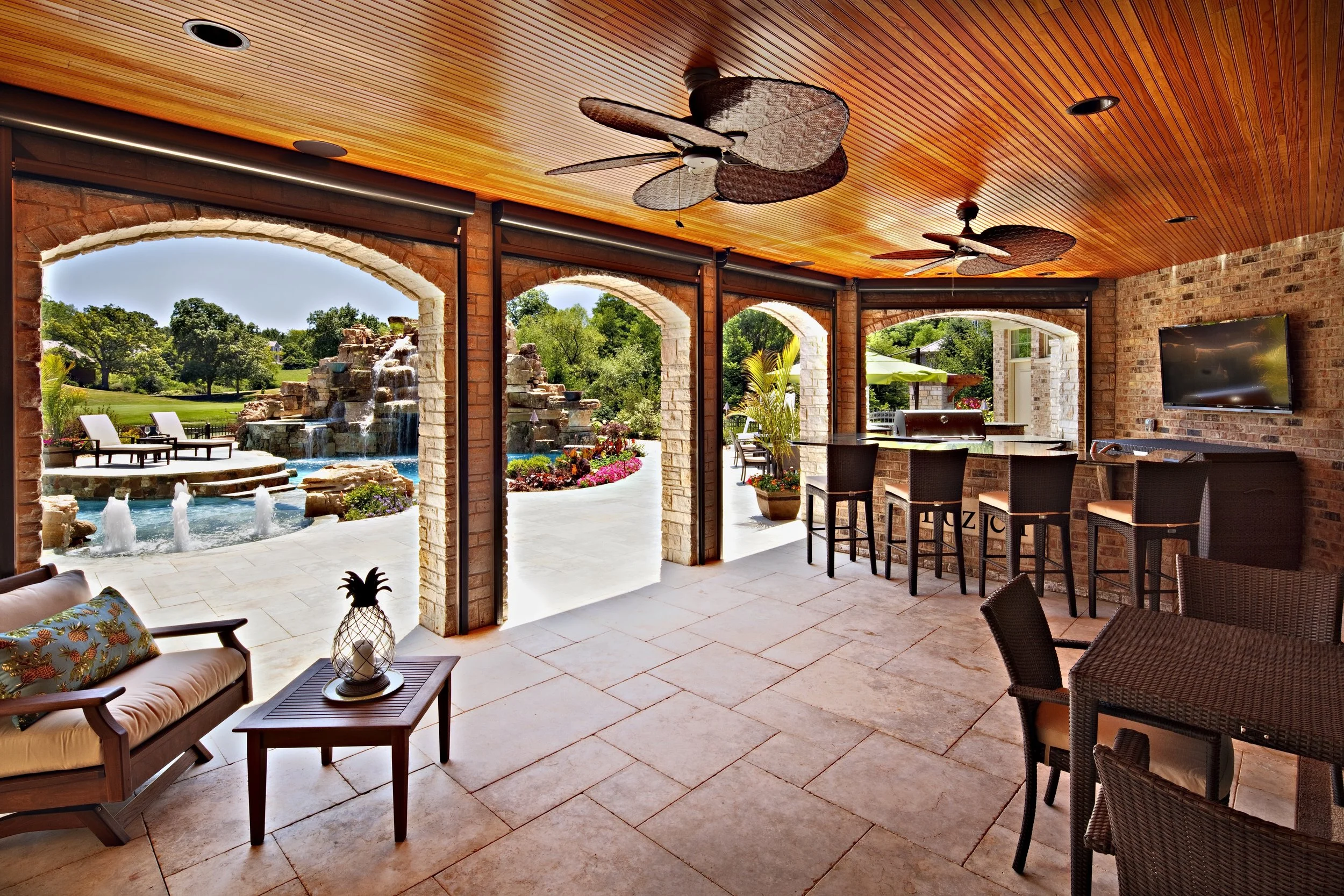 Custom Outdoor Kitchen with Retractable Roll Down Screens.  Bead Board Ceiling with Palm Fans.  Geneva Illinois 60134