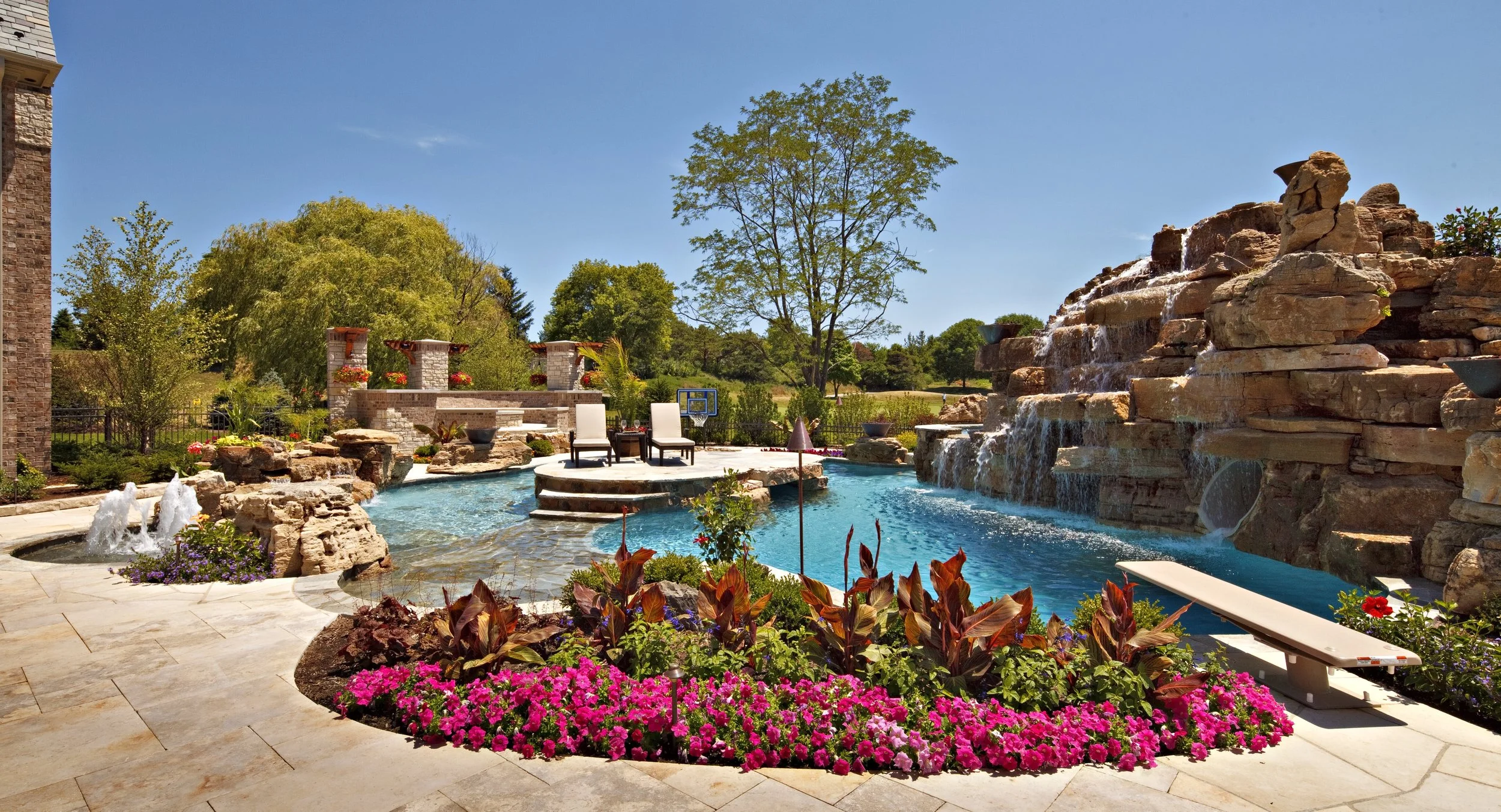 Custom Pool in Northern Illinois. Grotto, Slide, Hot Tub, Diving Board & Island.  Southampton Geneva IL. 60134