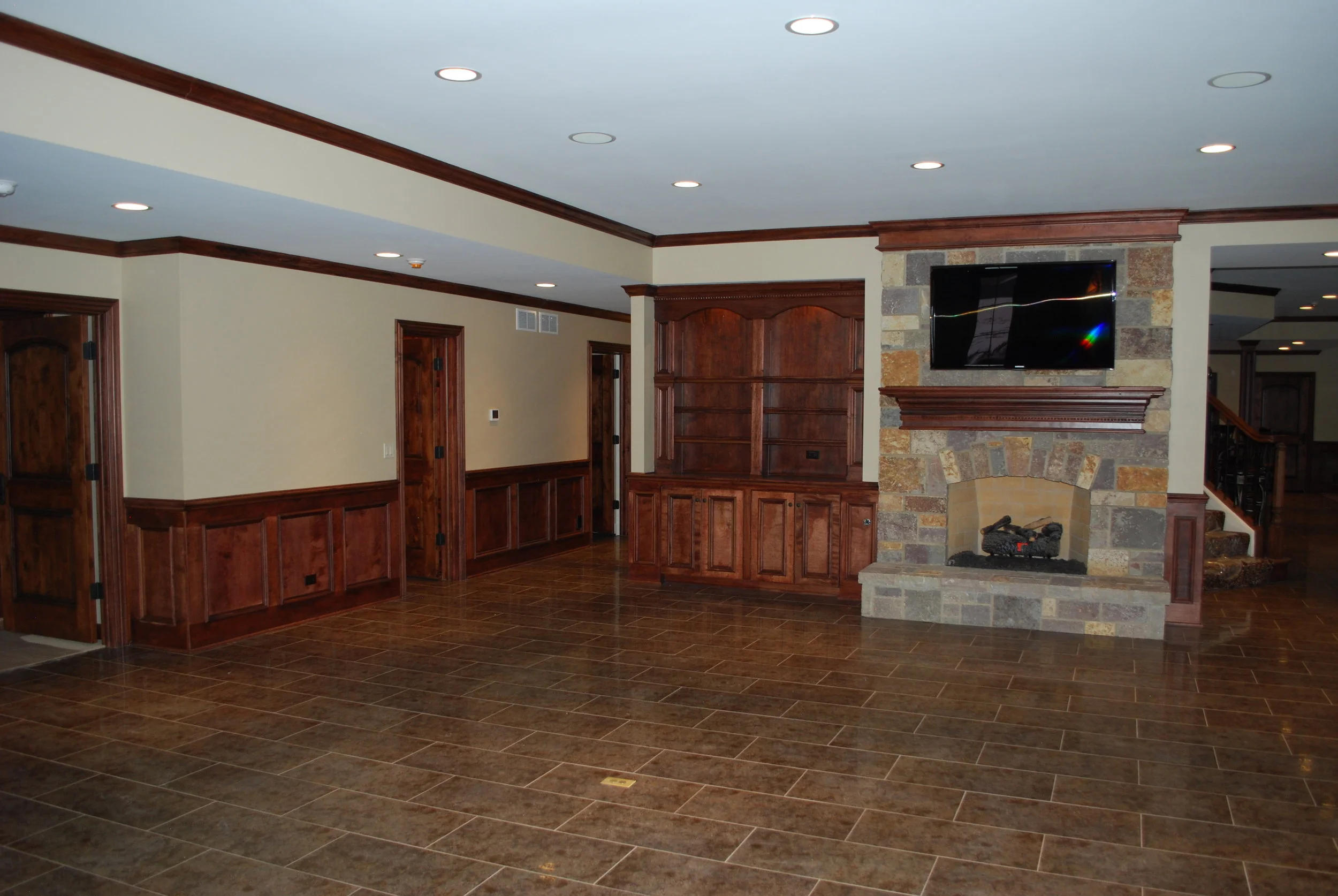 Colorful Stone Fireplace in this Naperville IL Custom Finished Basement 