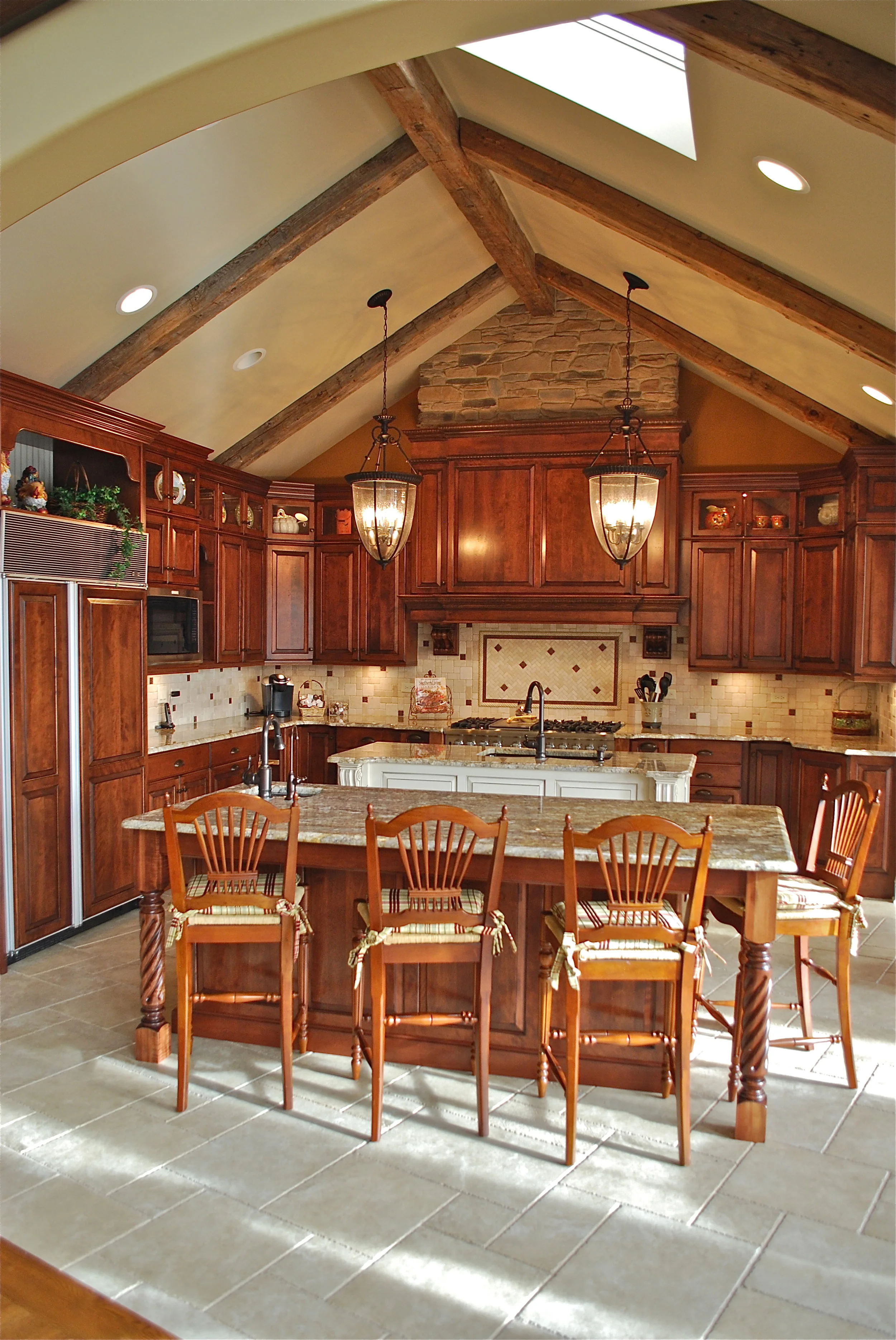 Custom Beams and Stacked Stone in this Rustic Kitchen Remodel