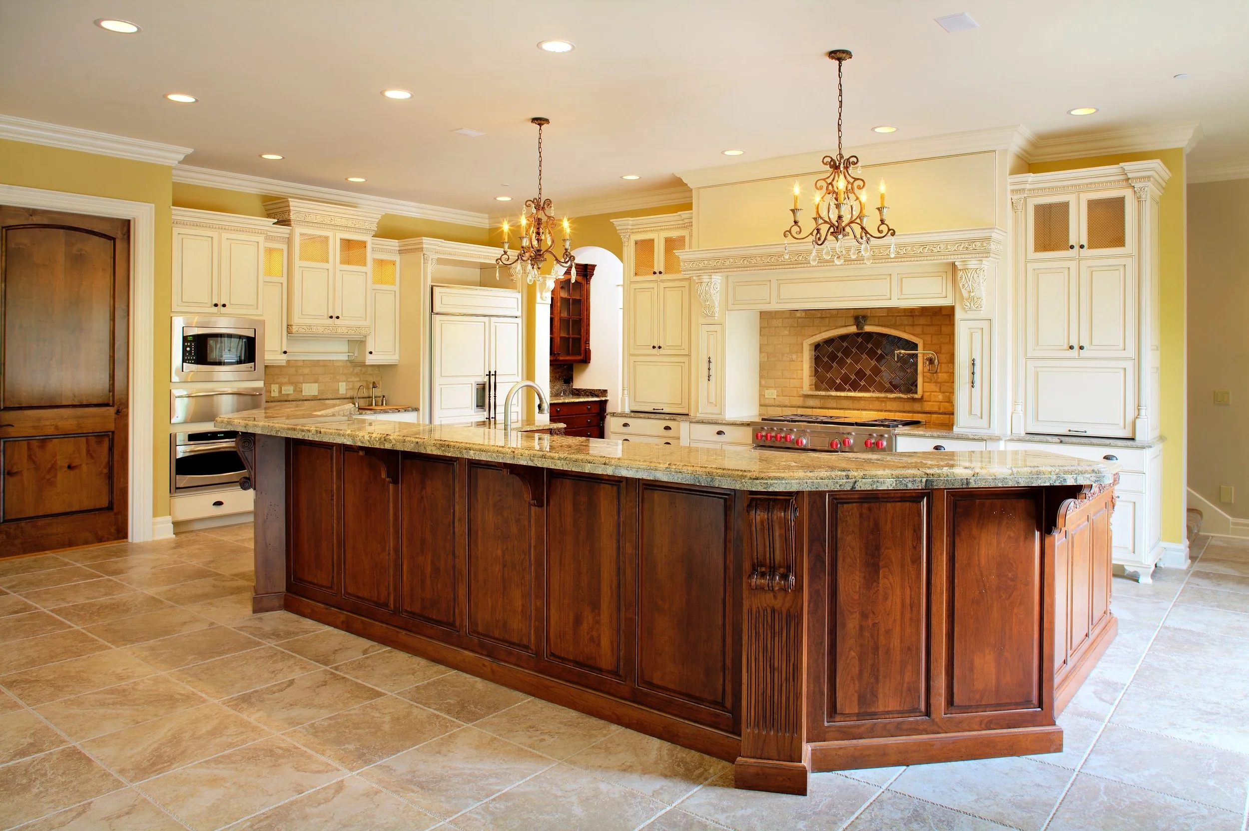Enkeboll Carved Trim Cabinet Application.  Stained Island and Painted Perimeter Cabinets.  Custom Kitchen in Geneva Illinois 60134. 
