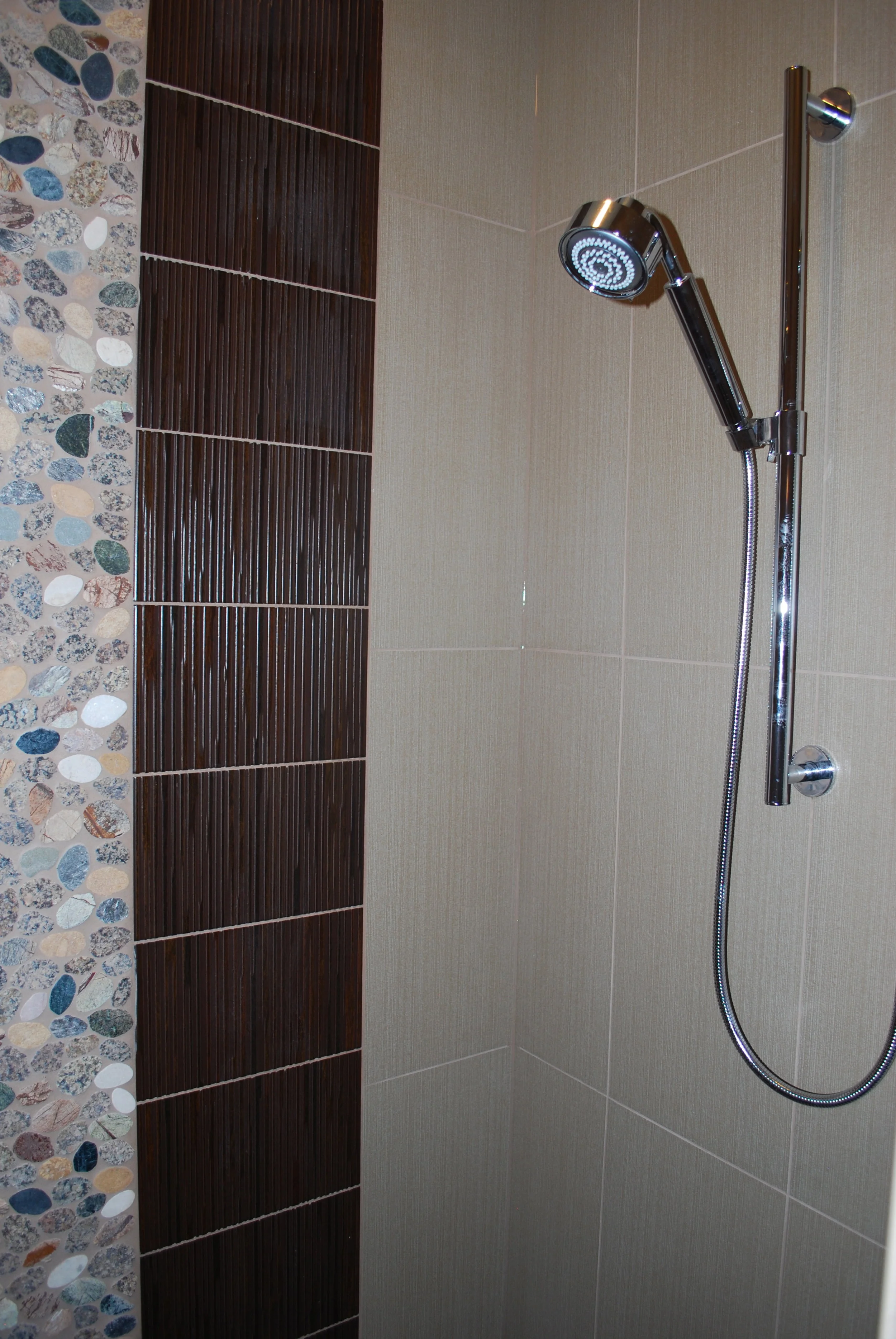 Custom Shower with Rock Pebbles and Linen Tile