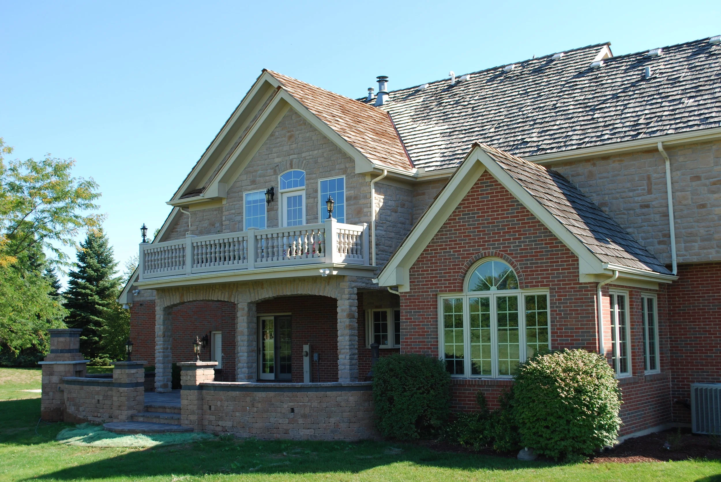 WATER PROOF DECK WITH TILE &amp; CRUSHED LIMESTONE COLUMNS IN THIS INVERNESS IL HOME BY BARRINGTON IL. SOUTHAMPTON BUILDERS LLC. IS LOCATED IN GENEVA IL.