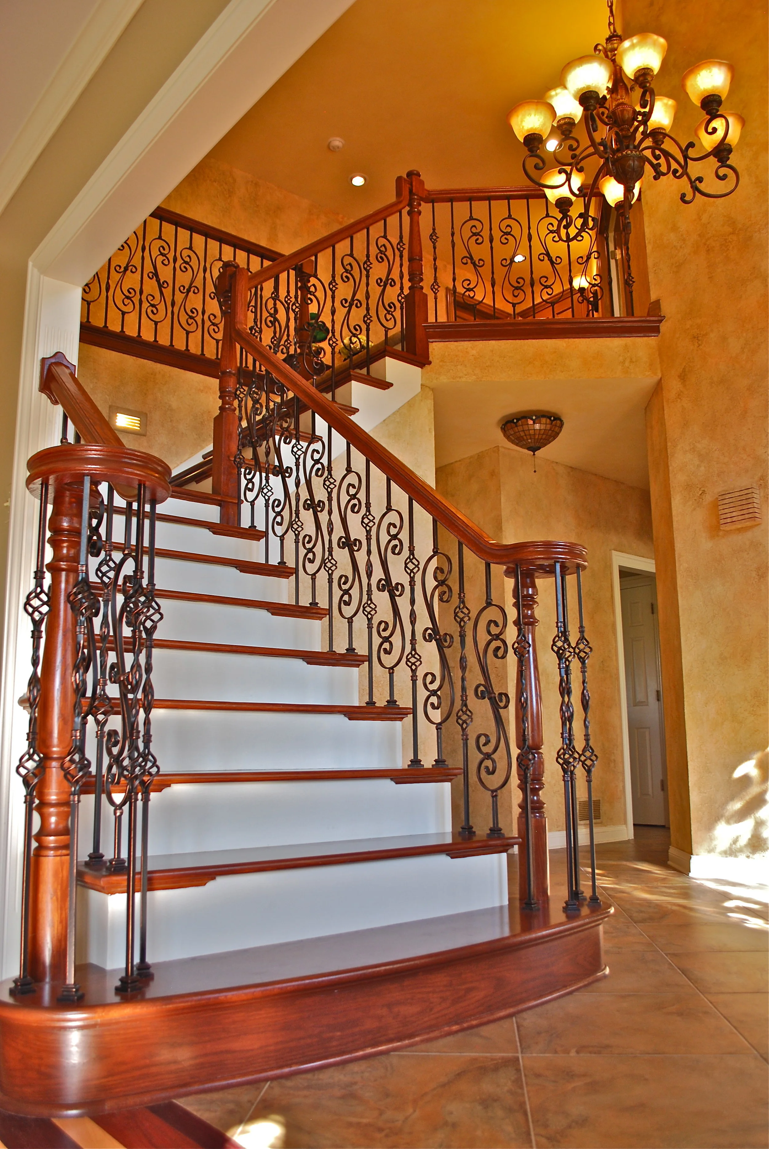 FOYER REMODEL &amp; UPDATING BY SOUTHAMPTON BUILDERS LLC. NEW ARCHED STARTING FIRST STEP. STAIR CASE REMODEL IN GENEVA IL. BARRINGTON IL.