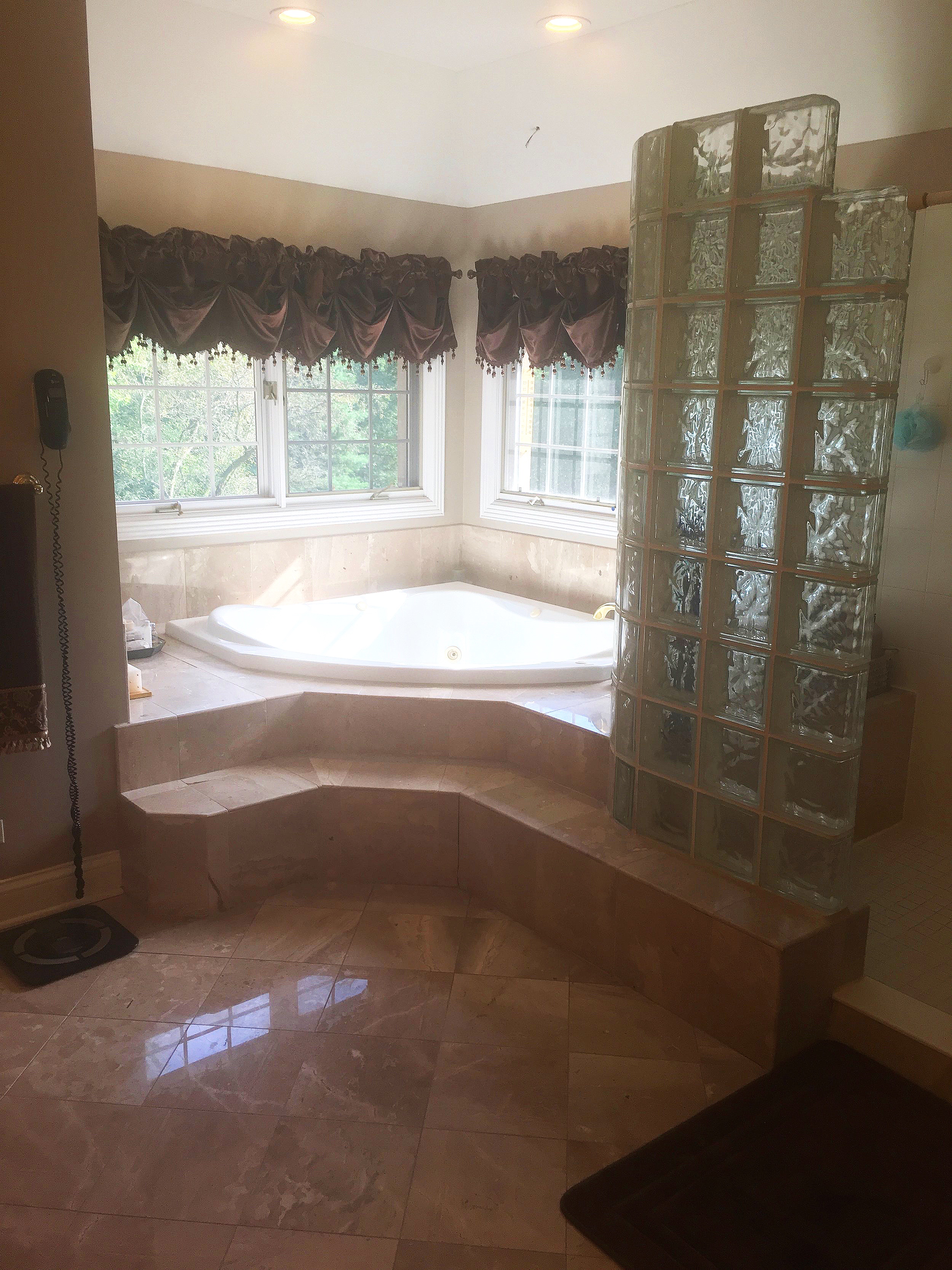 BEFORE PHOTO OF HUGE TUB DECK &amp; GLASS BLOCK SHOWER BEFORE BATHROOM REMODEL IN NAPERVILLE IL