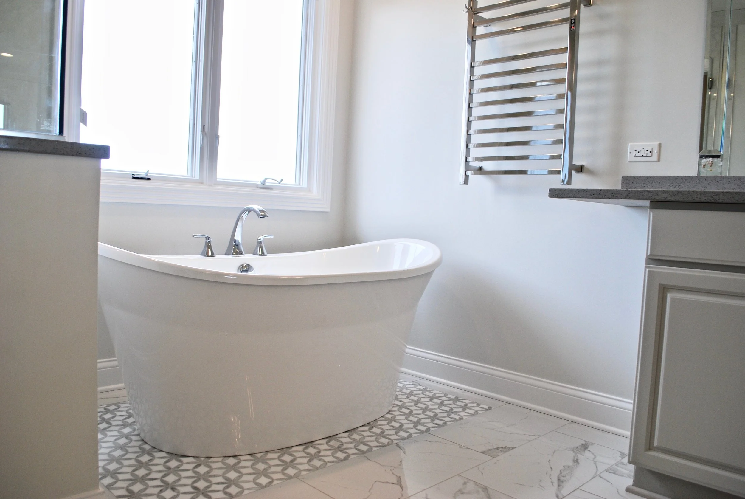Geneva IL. Bathroom Remodel with Freestanding Tub in Place of Oversized Tub Deck and Ugly Tile. Update Your bathroom for an Upcoming Sale or for Your Enjoyment. St. Charles IL.