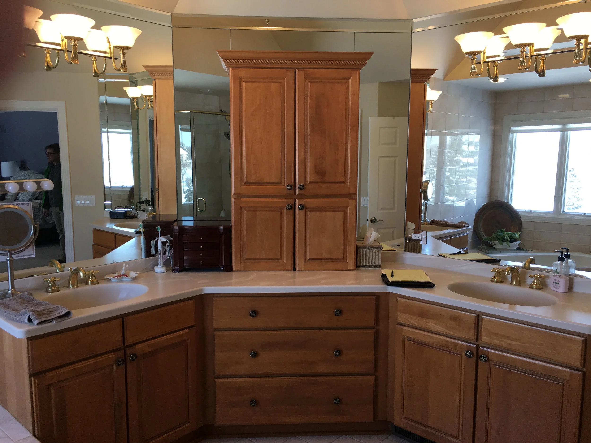 Before Photo of Geneva IL. Master Bathroom Before Remodeling. Painted Cabinetry, New Freestanding Tub in Place of Corner Whirlpool Tub and Oversized Tub Deck. New Marble Shower.
