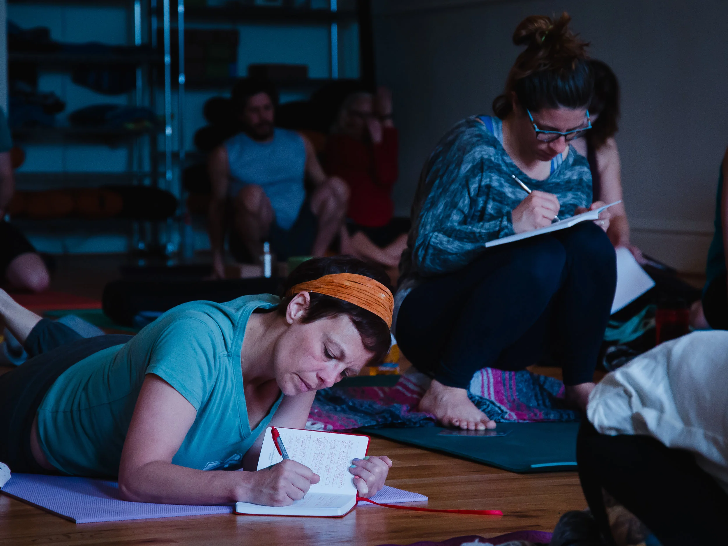 Yoga students journaling