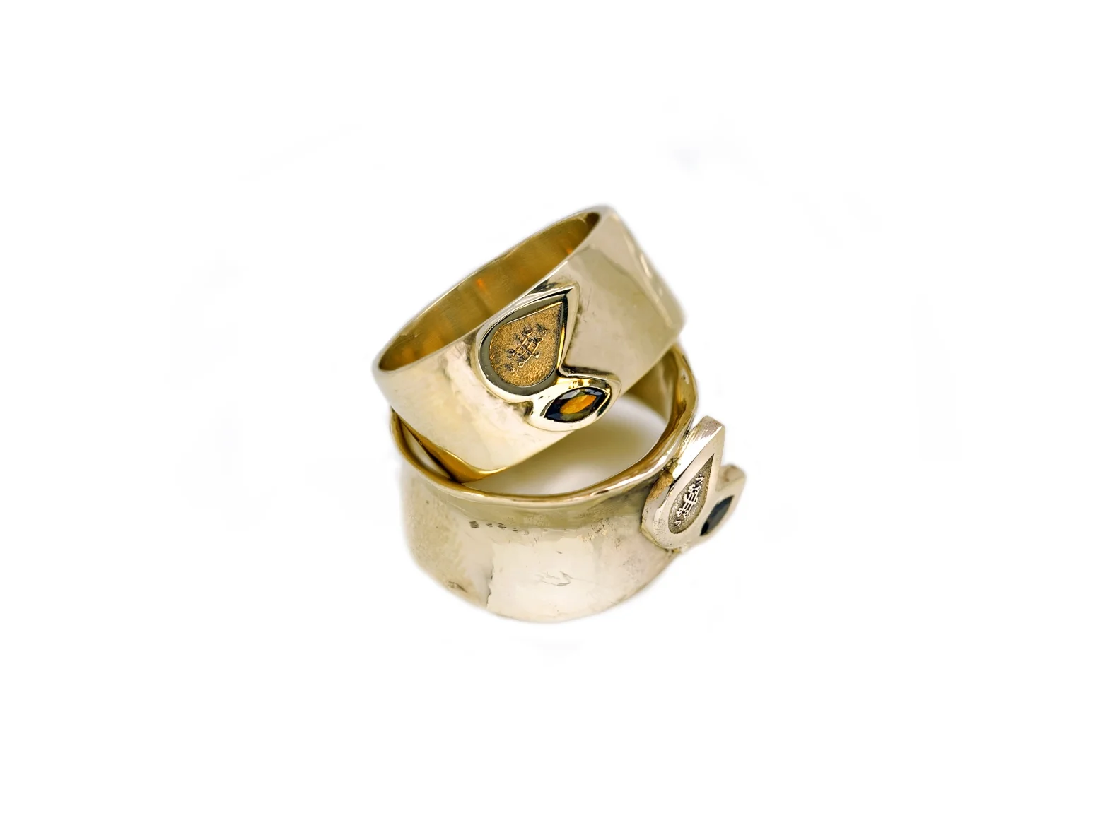 TWO LEAVES RING | 14 karat yellow gold Baha'i rings with bezel set marquise andulasites, and laser engraved Ringstone Symbol relief.