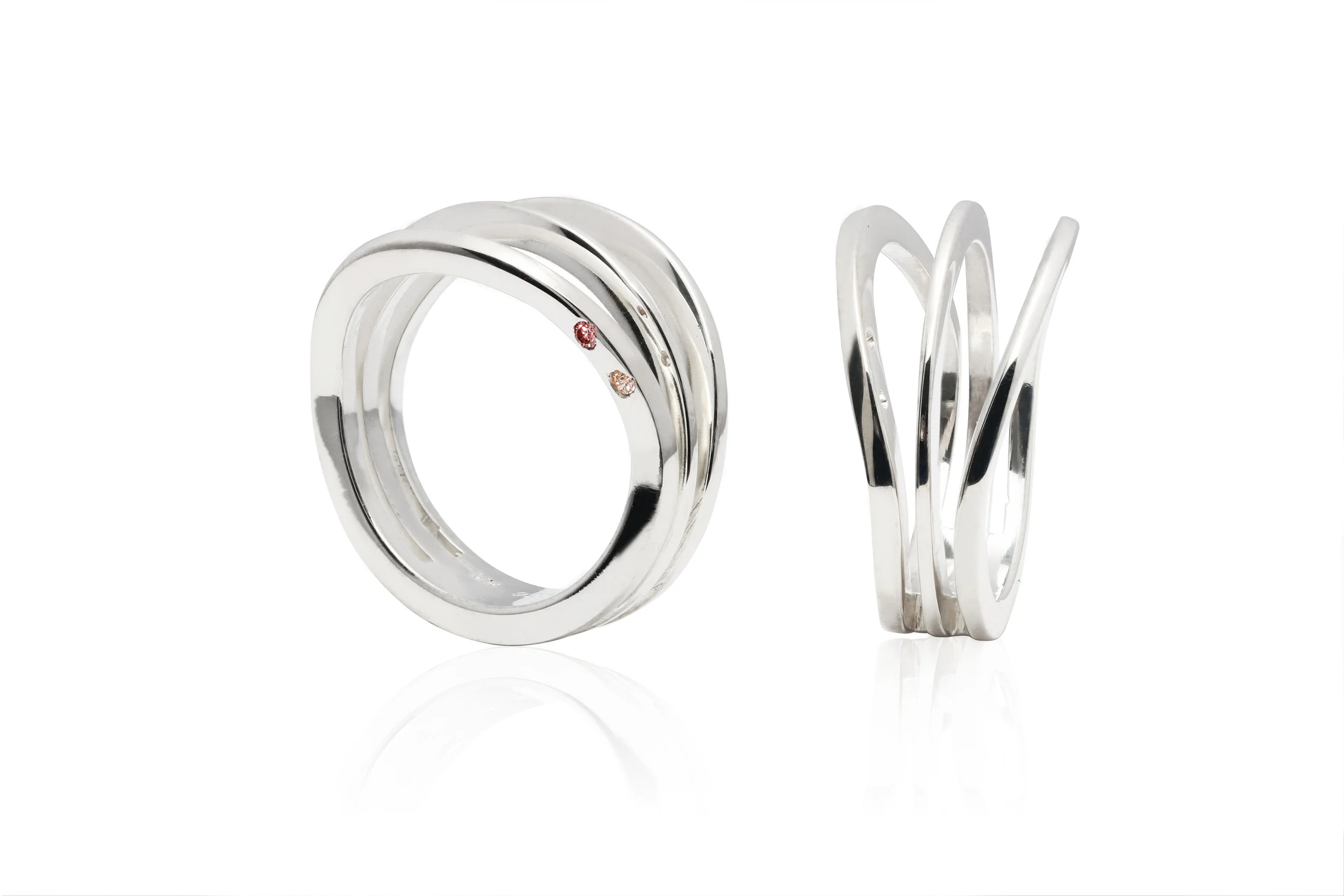 SILVER ARCHITECTURAL RING | Fully fabricated silver ring with two flush set 0.02 carat fancy pink brilliant cut diamonds.