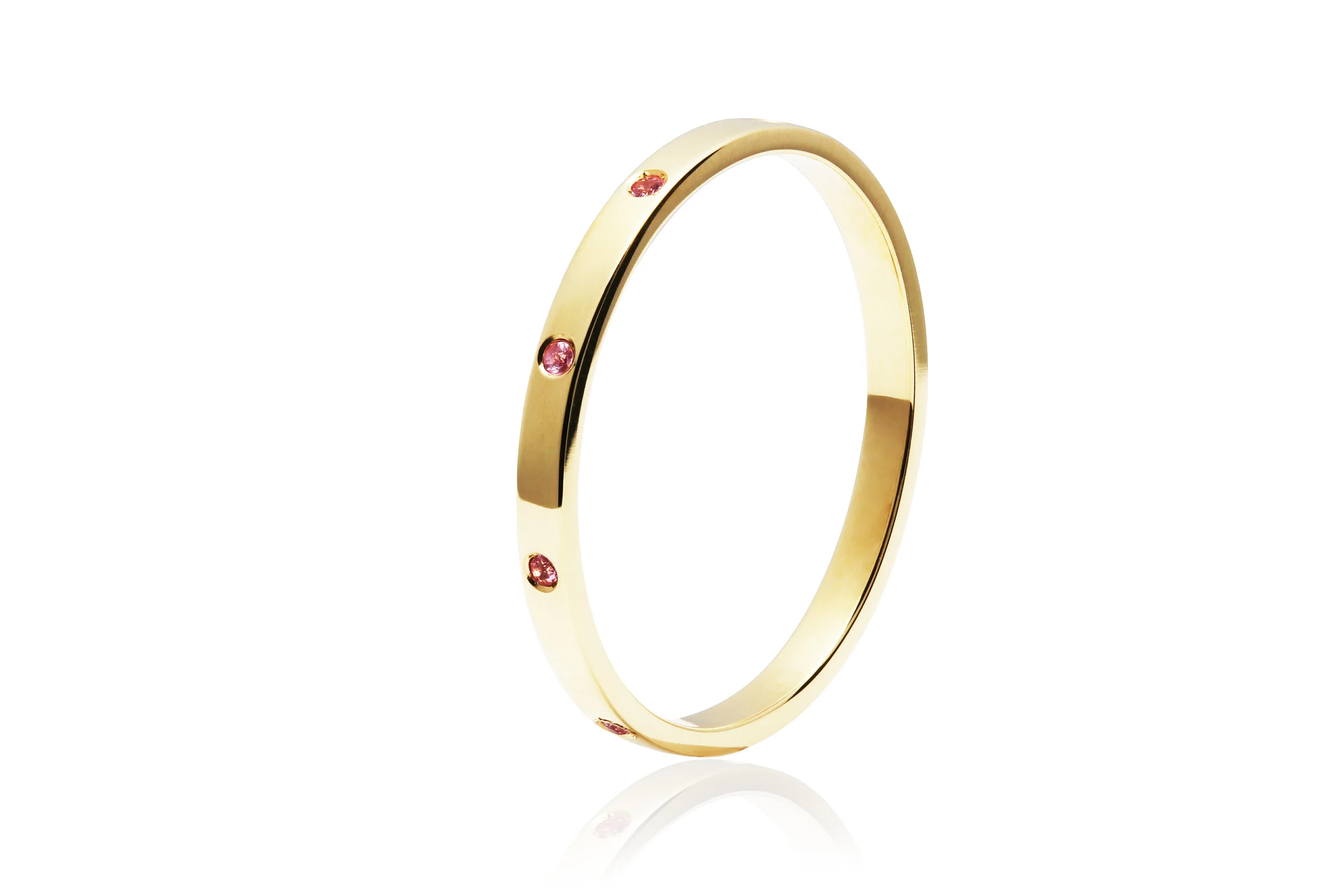 SAPPHIRE BAND | 18 karat yellow gold band with nine natural pink sapphires