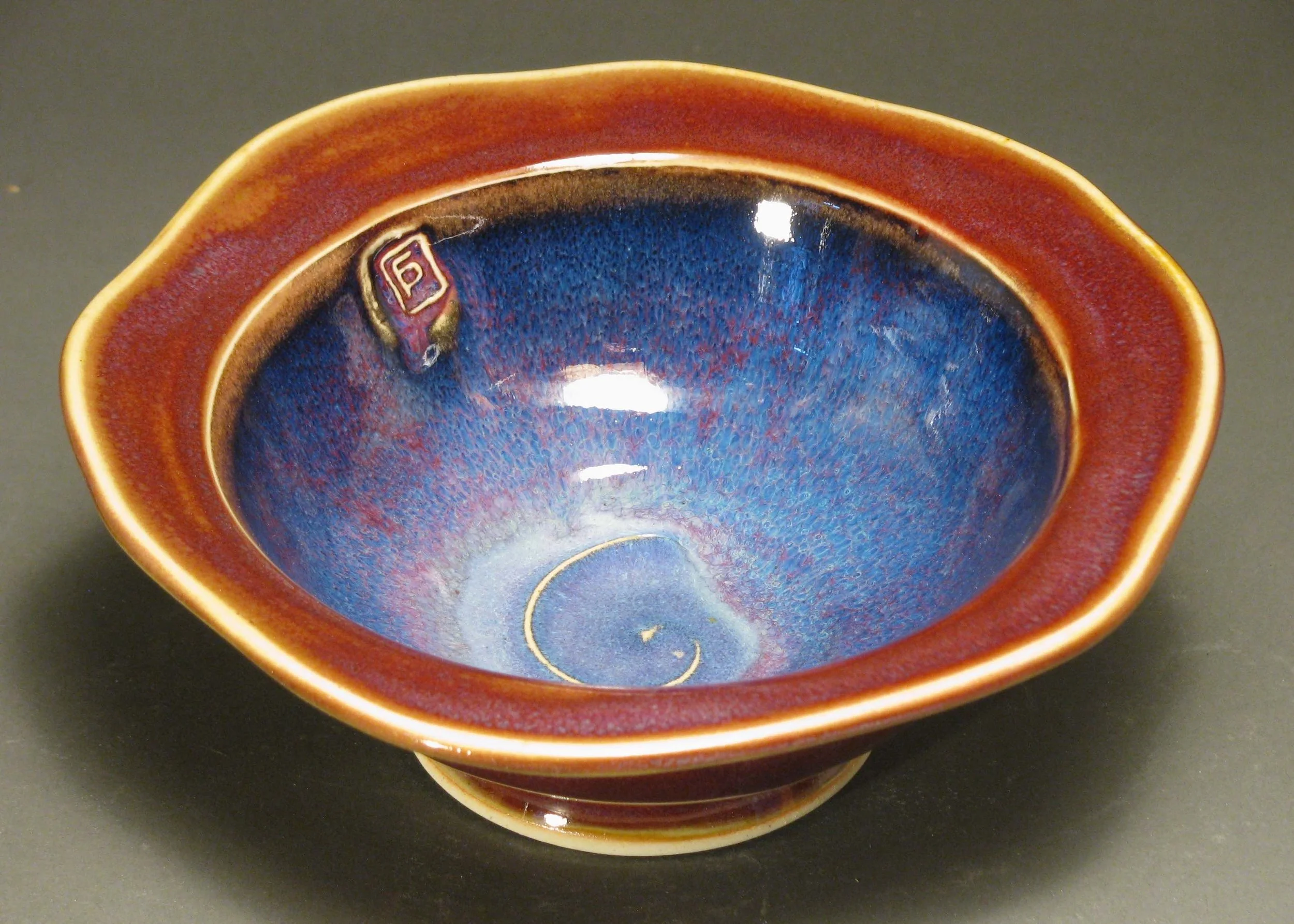 Soup bowl with cut rim 7.5" diameter Glazes: purple haze and copper red
