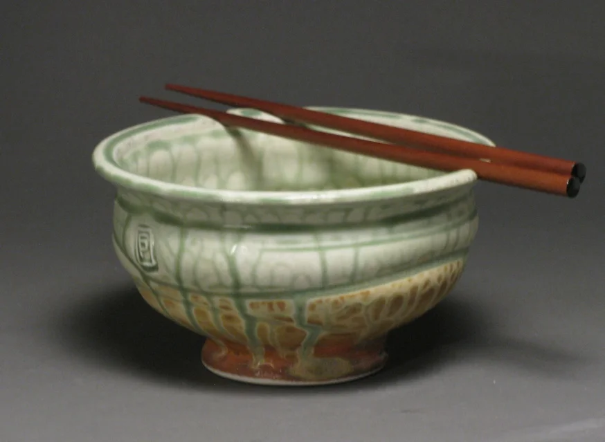 Noodle bowl 6" diameter Glazes: green ash and matte rust