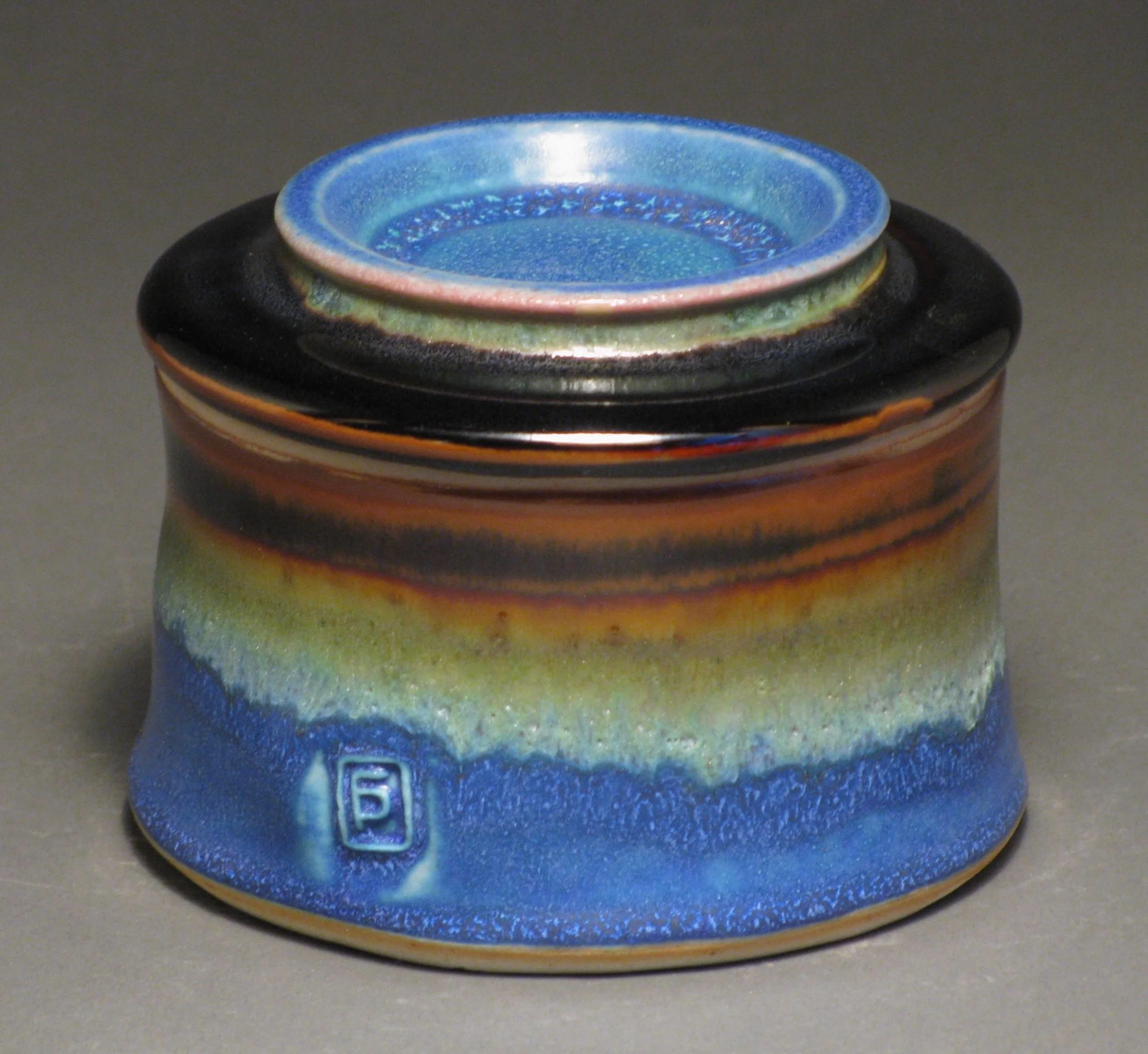 Butter crock 3" tall Glazes: matte blue and temmoku