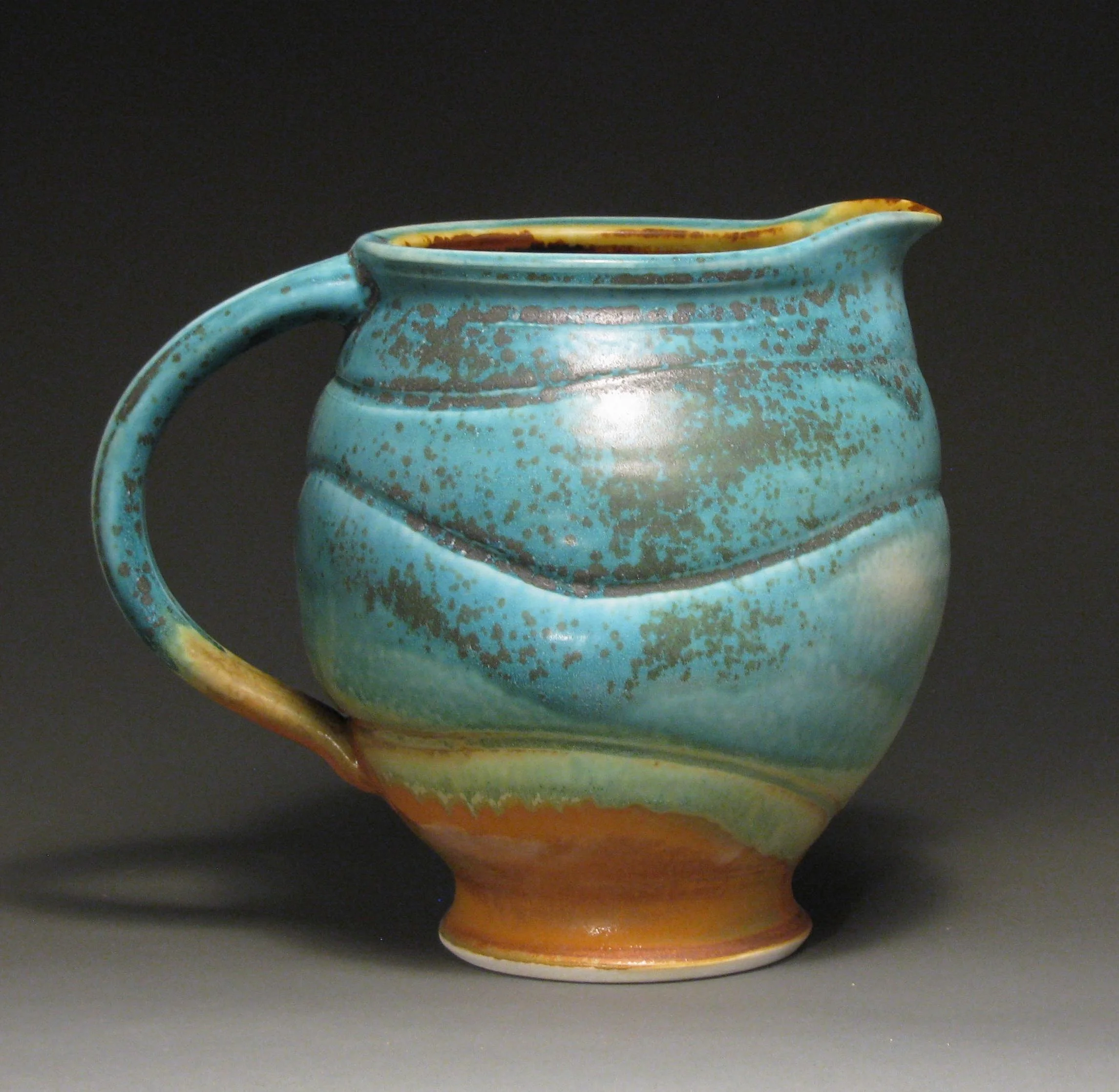 Pitcher 9" tall Glazes: matte turquoise and matte rust