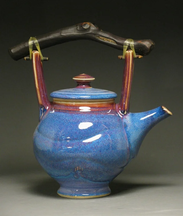 Teapot 10.5" tall Glazes: purple haze and copper red