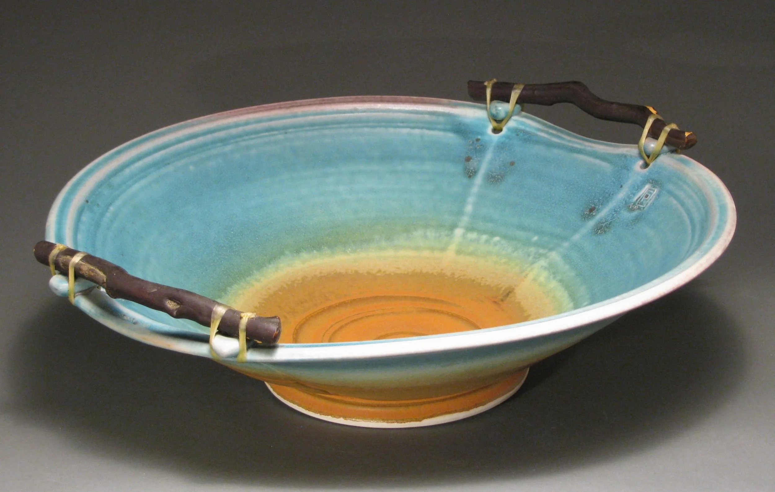 Manzanita handled bowl 15" diameter Glazes: matte turquoise and matte rust