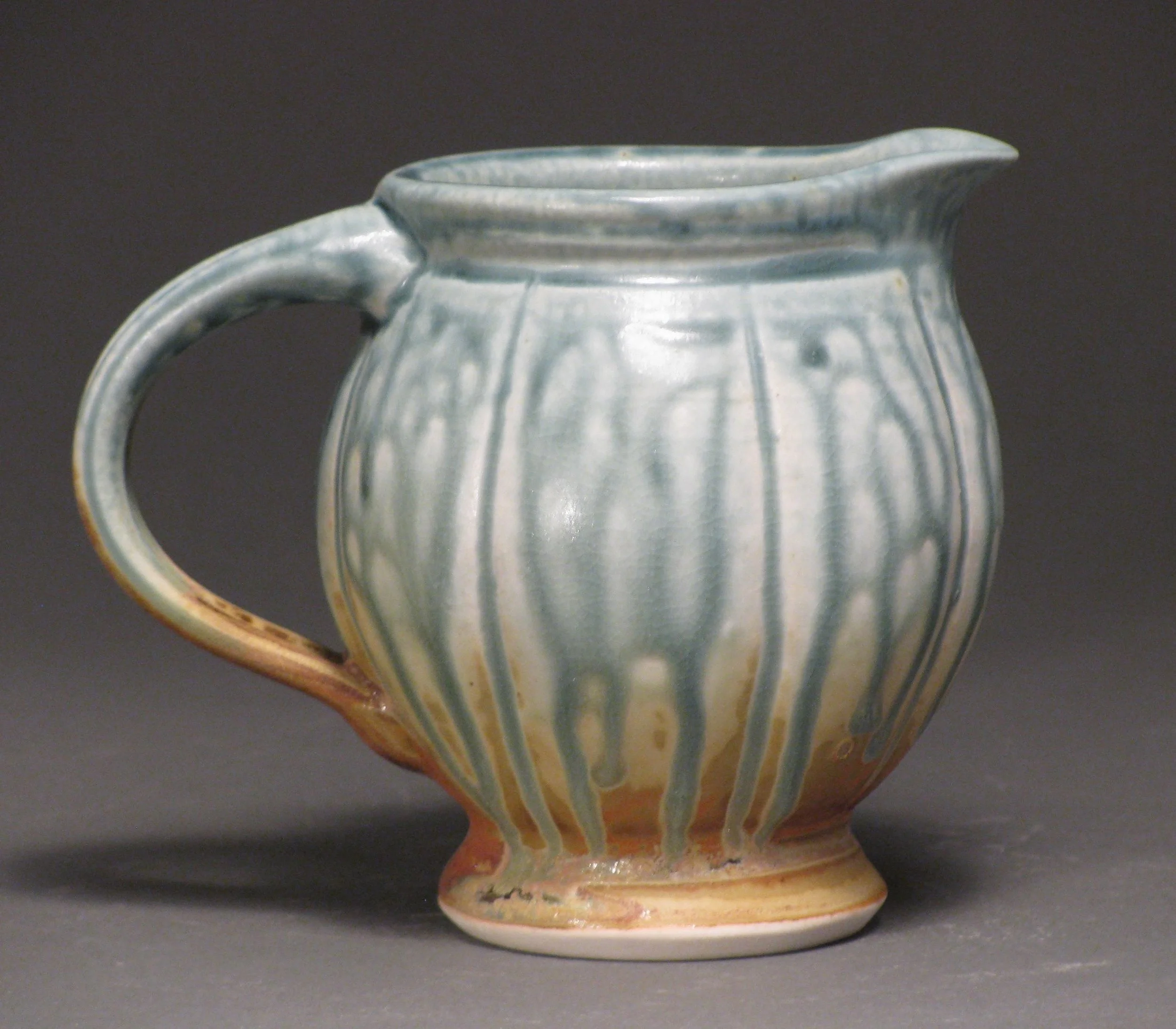 Creamer 3.5" tall Glazes: blue ash and matte rust