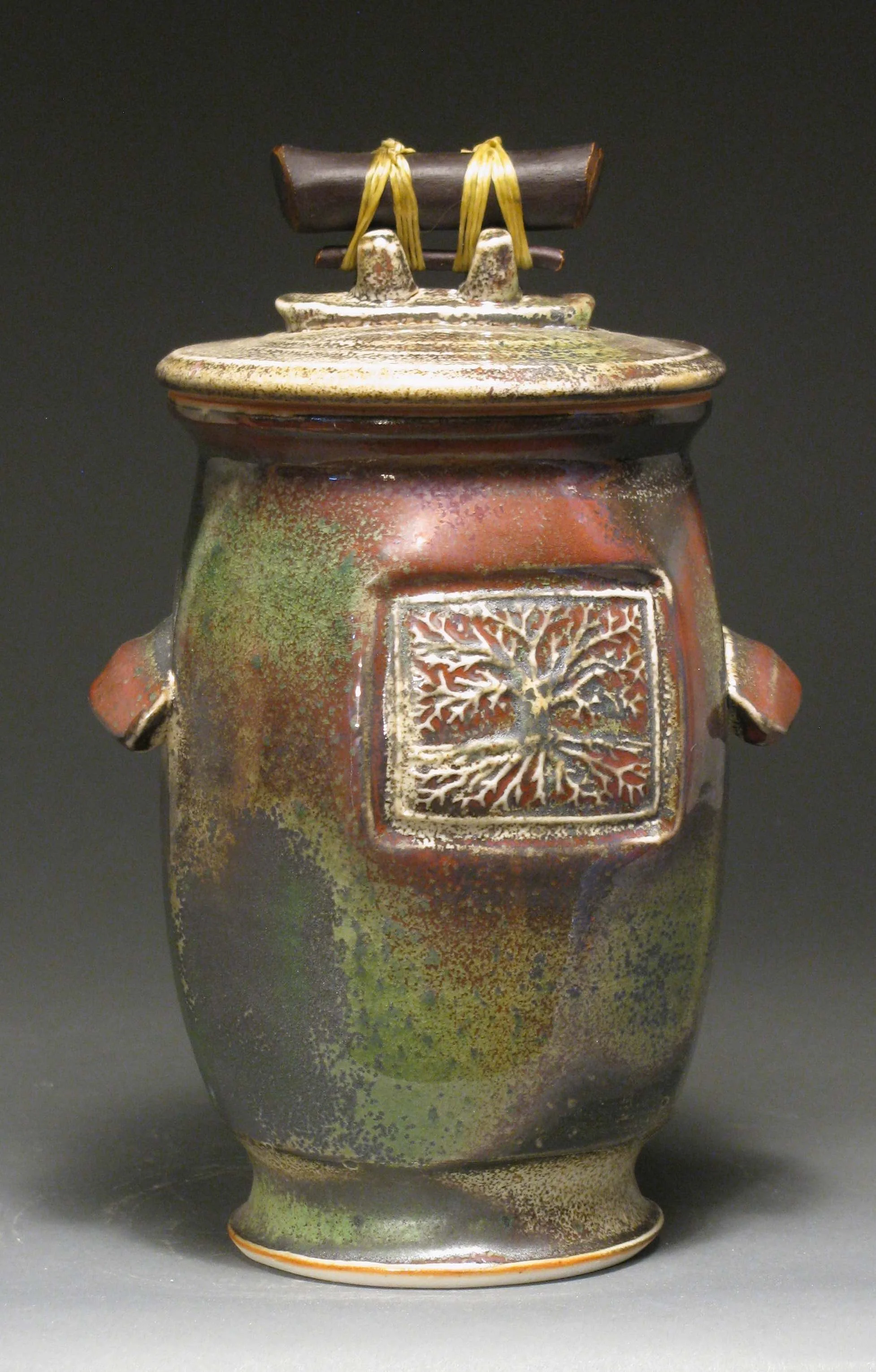 Lidded jar 10" tall Glazes: white shino and Rob's green