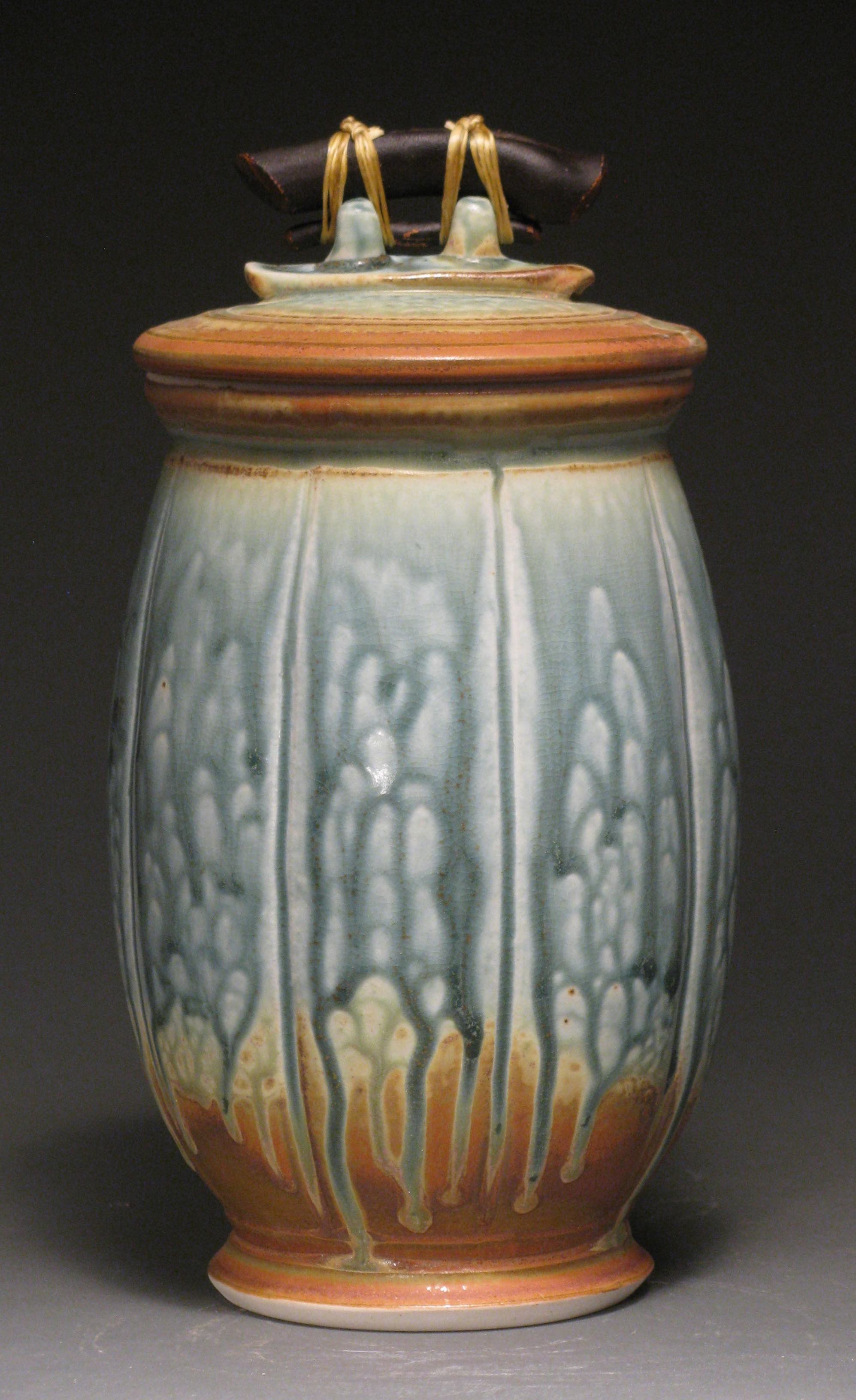 Lidded jar 10" tall Glazes: blue ash and matte rust