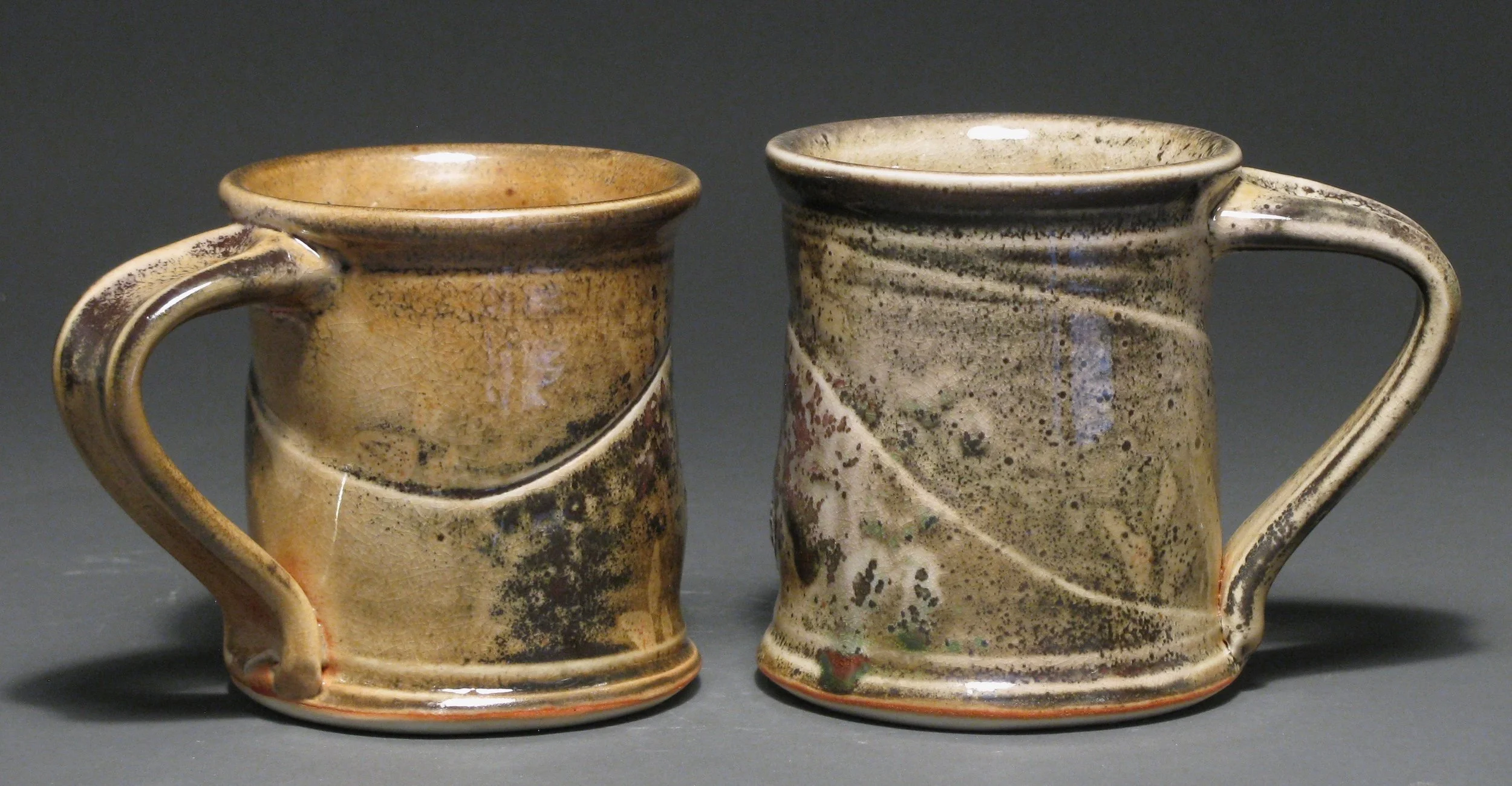 Cylindrical mugs 4" tall Glaze: Davis shino