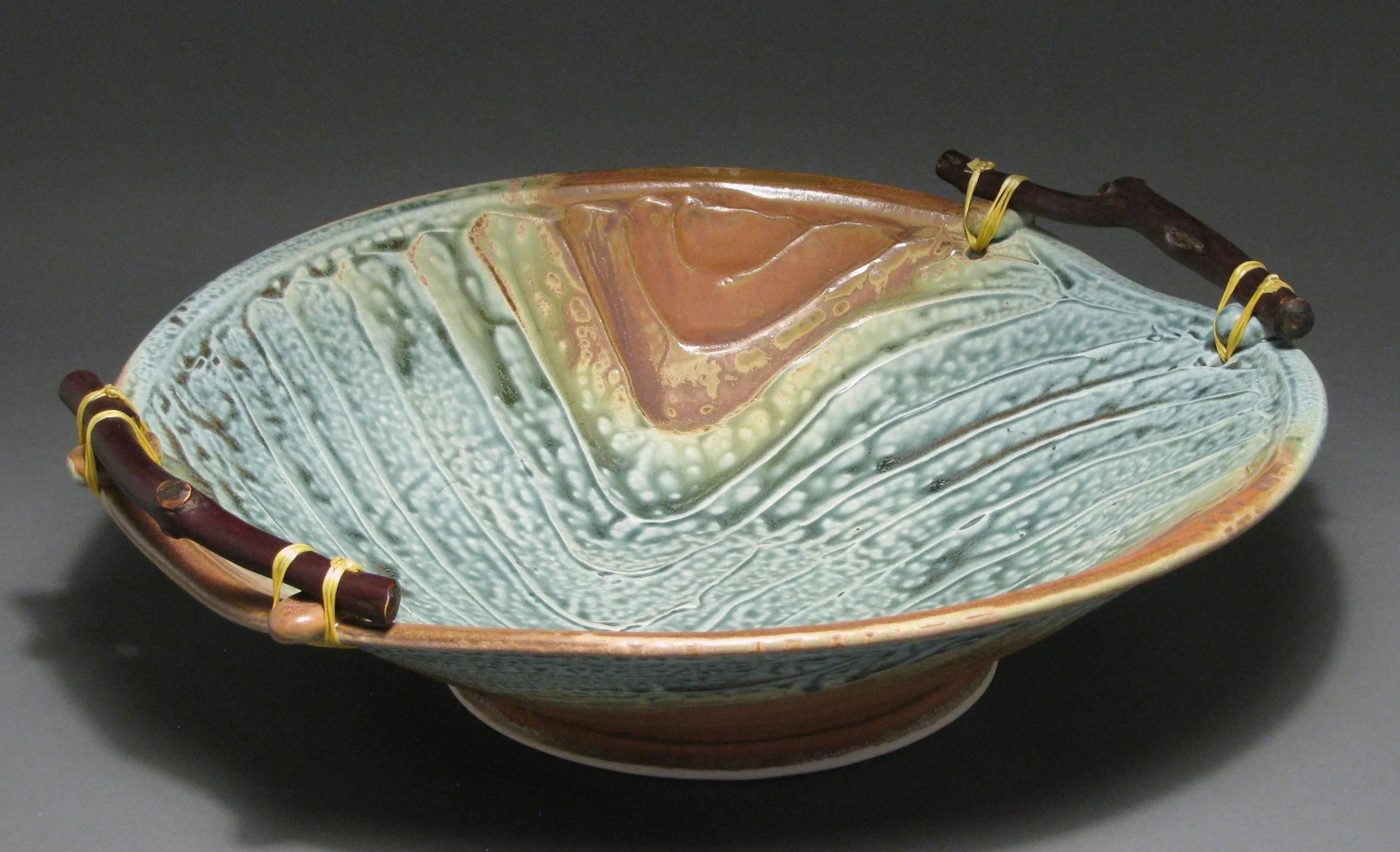 Manzanita handled bowl 16" diameter Glazes: blue ash and matte rust