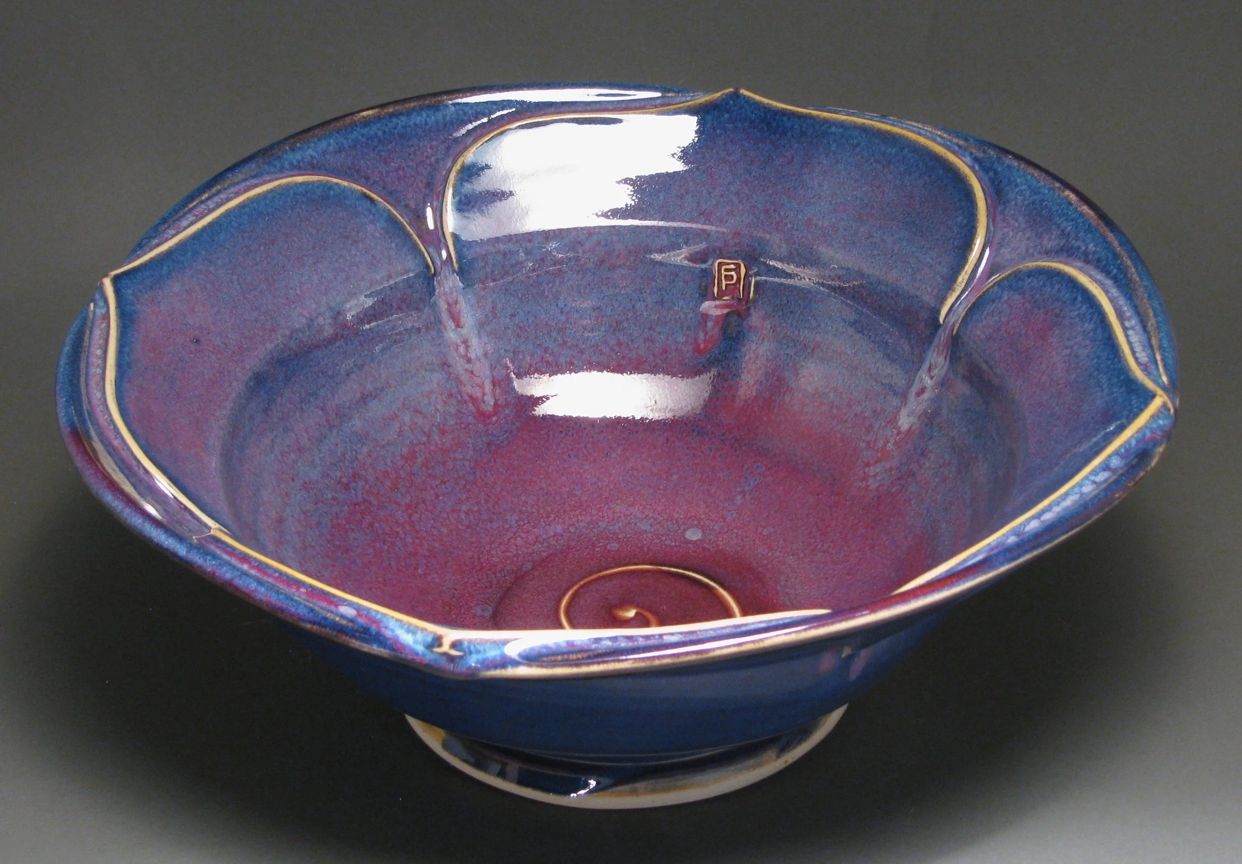 Lotus bowl 14" diameter Glazes: purple haze and copper red