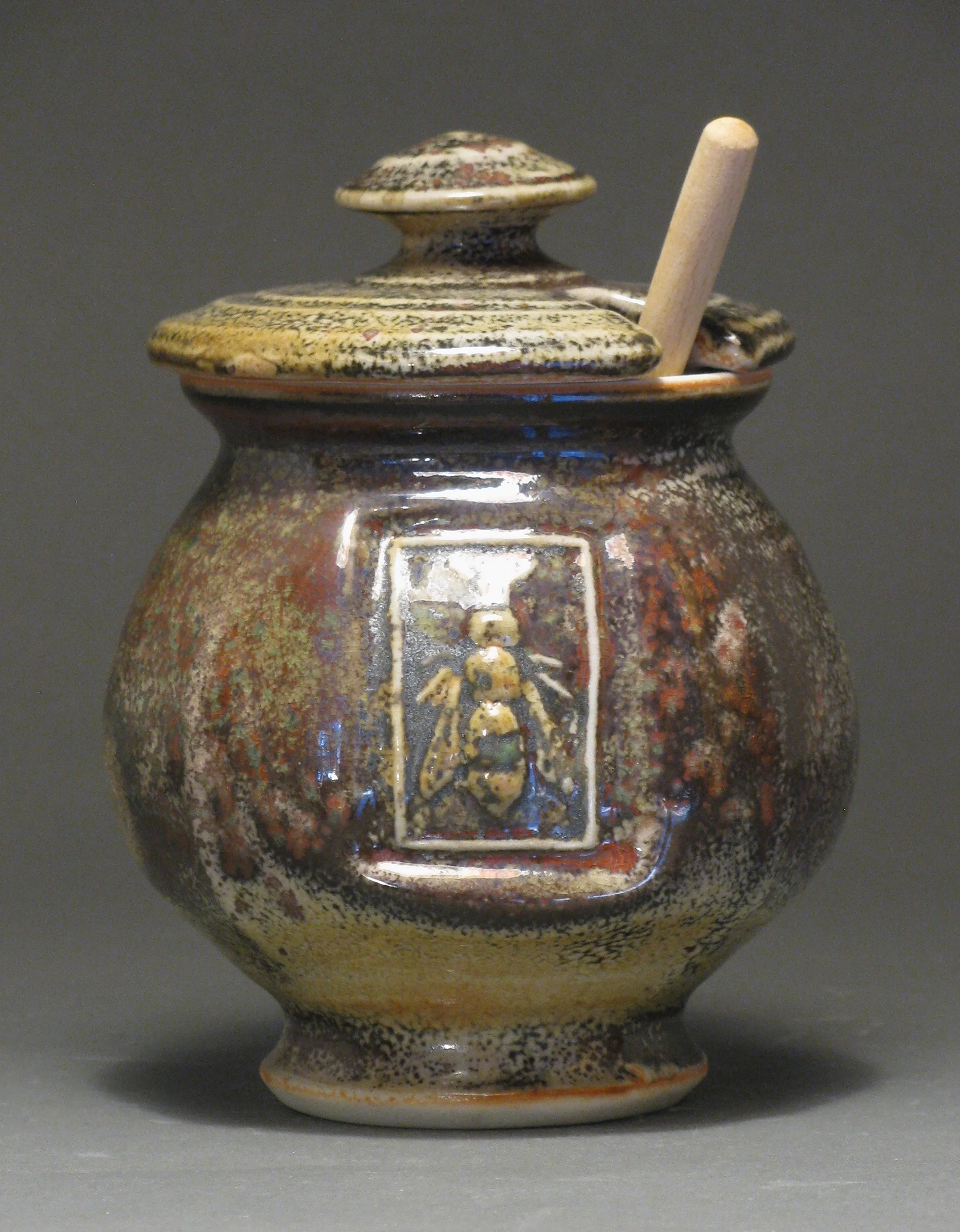 Honey jar 5.5" tall Glazes: Davis shino with Rob’s Green