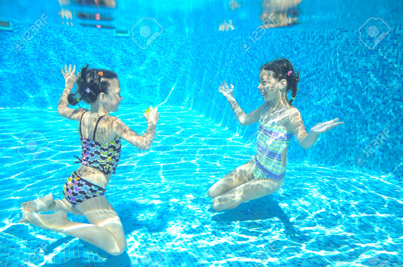 31252410-Happy-active-kids-swim-in-pool-and-play-underwater-girls-diving-and-having-fun-children-on-summer-va-Stock-Photo.jpg