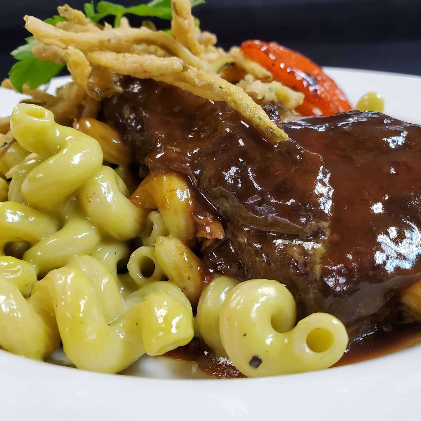 Texas Kobe Beef Short Rib served with roasted poblano and cavatappi &quot;mac and cheese&quot;, anchor chile demi-glace and crispy zucchini