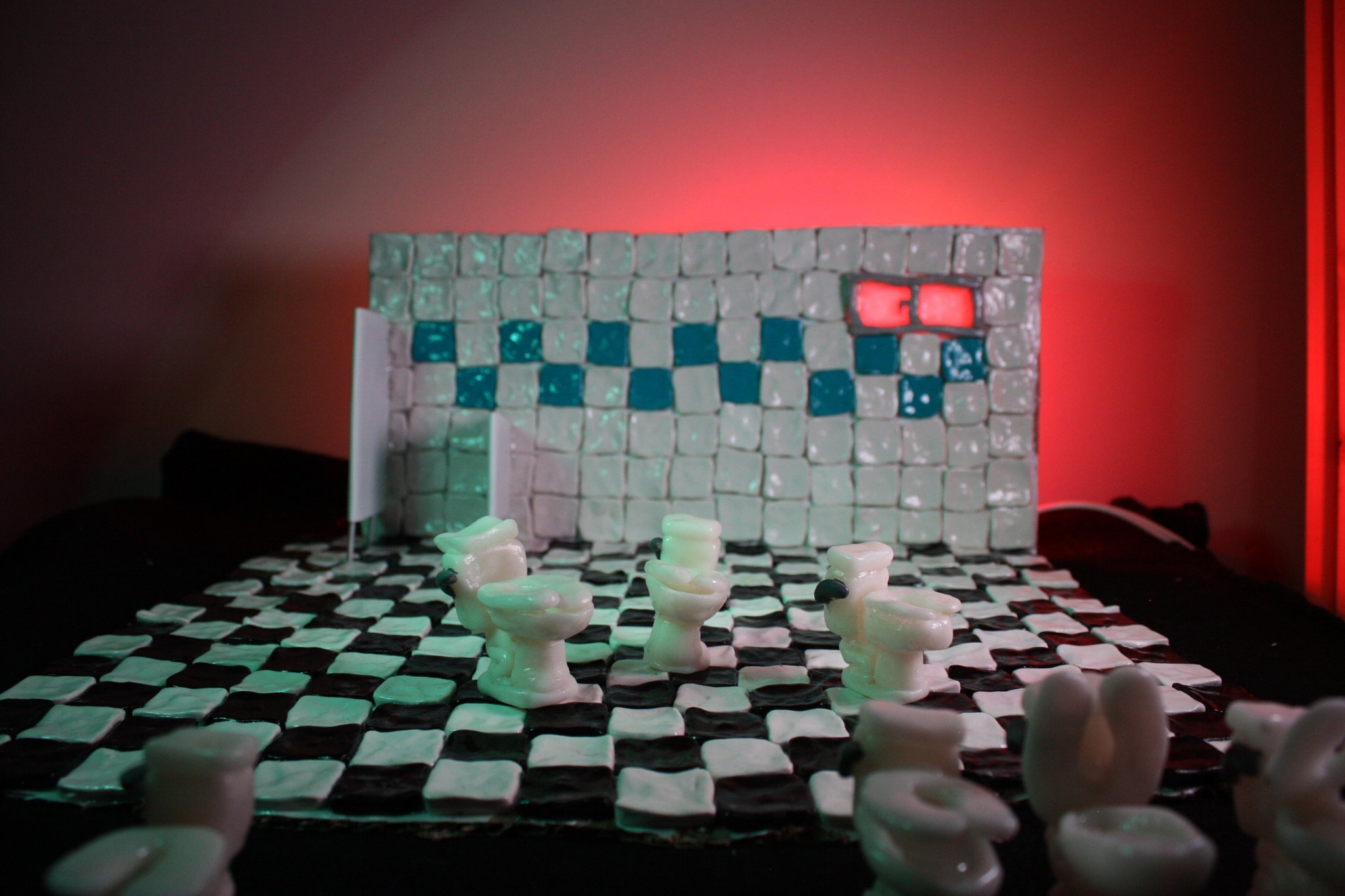  a still from a camera test i did with a bathroom miniature set i made out of sculpey and cardboard and glossy acrylic medium. i still haven’t figured out what i’m going to do with this. there are a bunch of tiny toilets i made as well. made in april