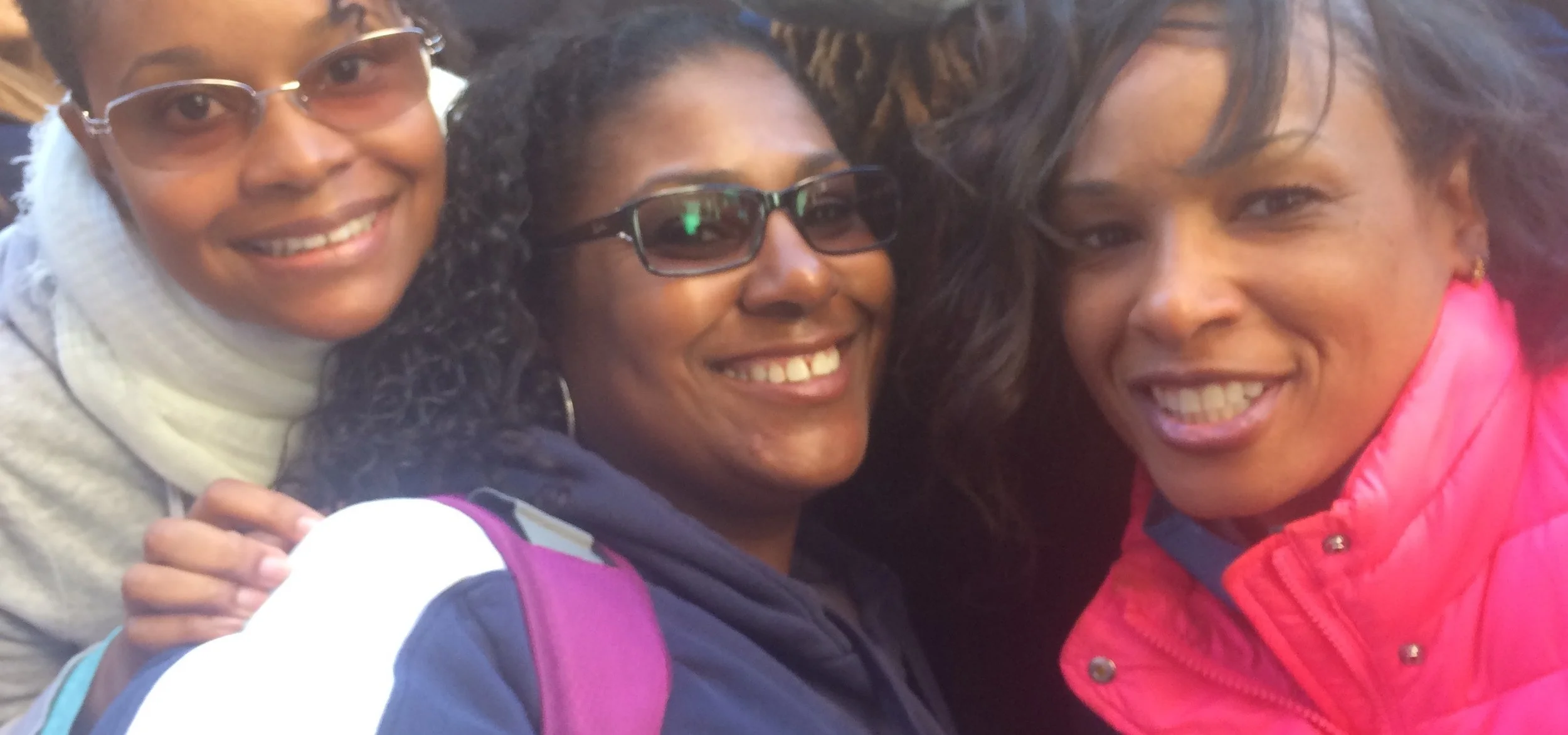 Dawn Jones (center) and friends were all smiles for the march, as well as the struggles ahead. (Photo by Loud Owl)
